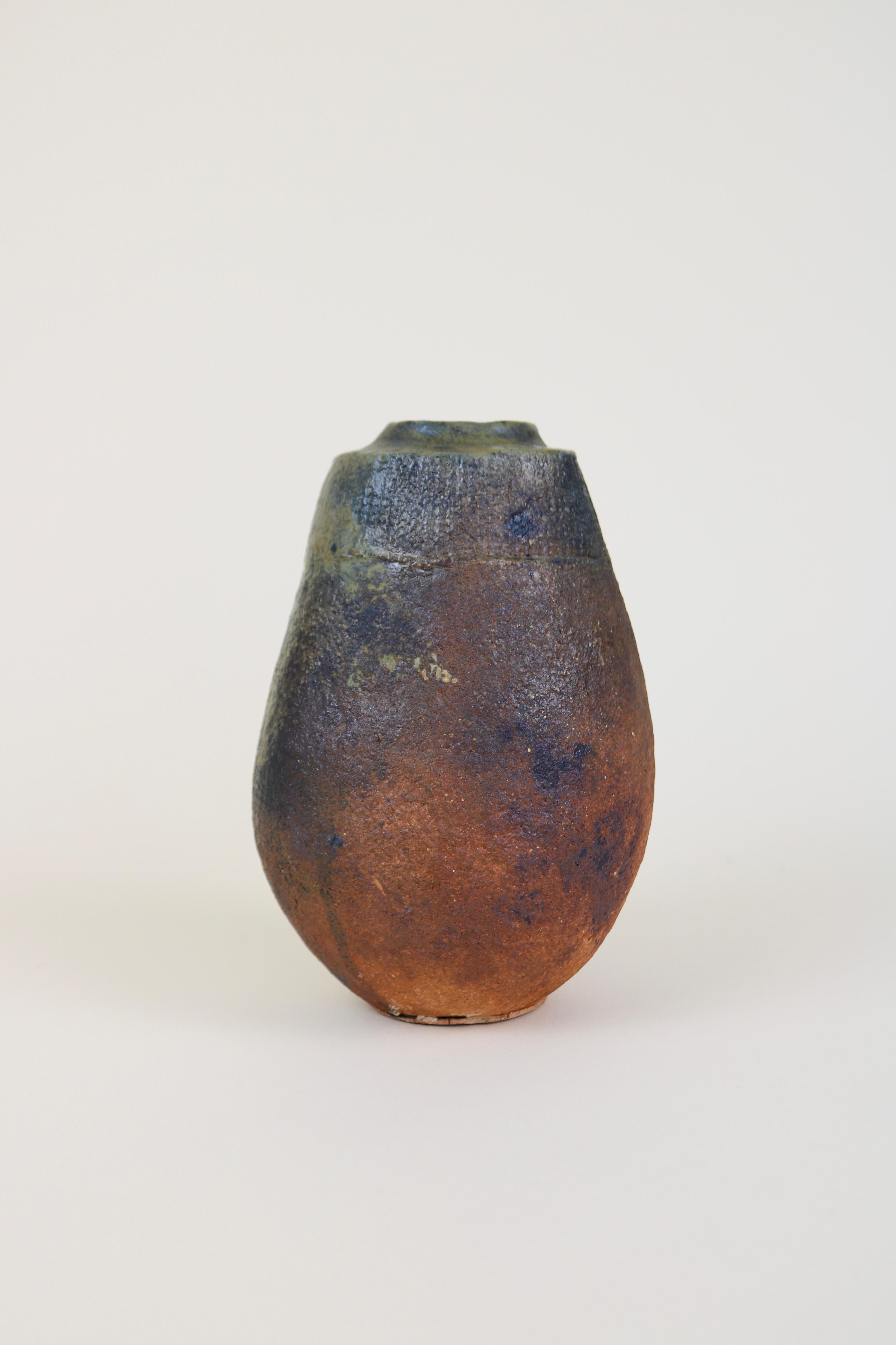 A ceramic sculptural vase by La Borne potter Gérard Brossard, circa 1980.
A chunky and heavy stoneware vase with an asymmetric form and a rough handmade feel.

Brossard was a student of Jean and Jacqueline Lerat in the 1970s.
In perfect