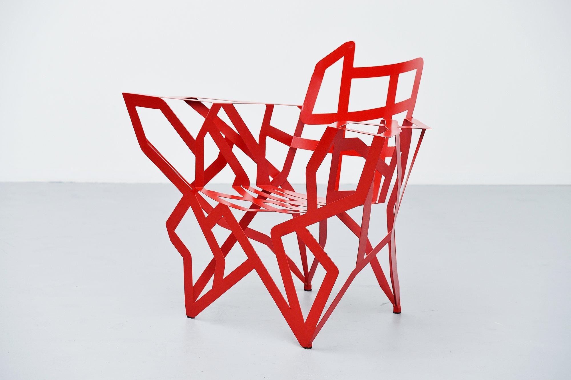 Extraordinary chair designed by Gerard Coquelin, manufactured in his own atelier in France, 1990. The chair is made of red painted metal, completely welded into perfection. Gérard Coquelin was born in 1947 and since 1980 he designs and makes