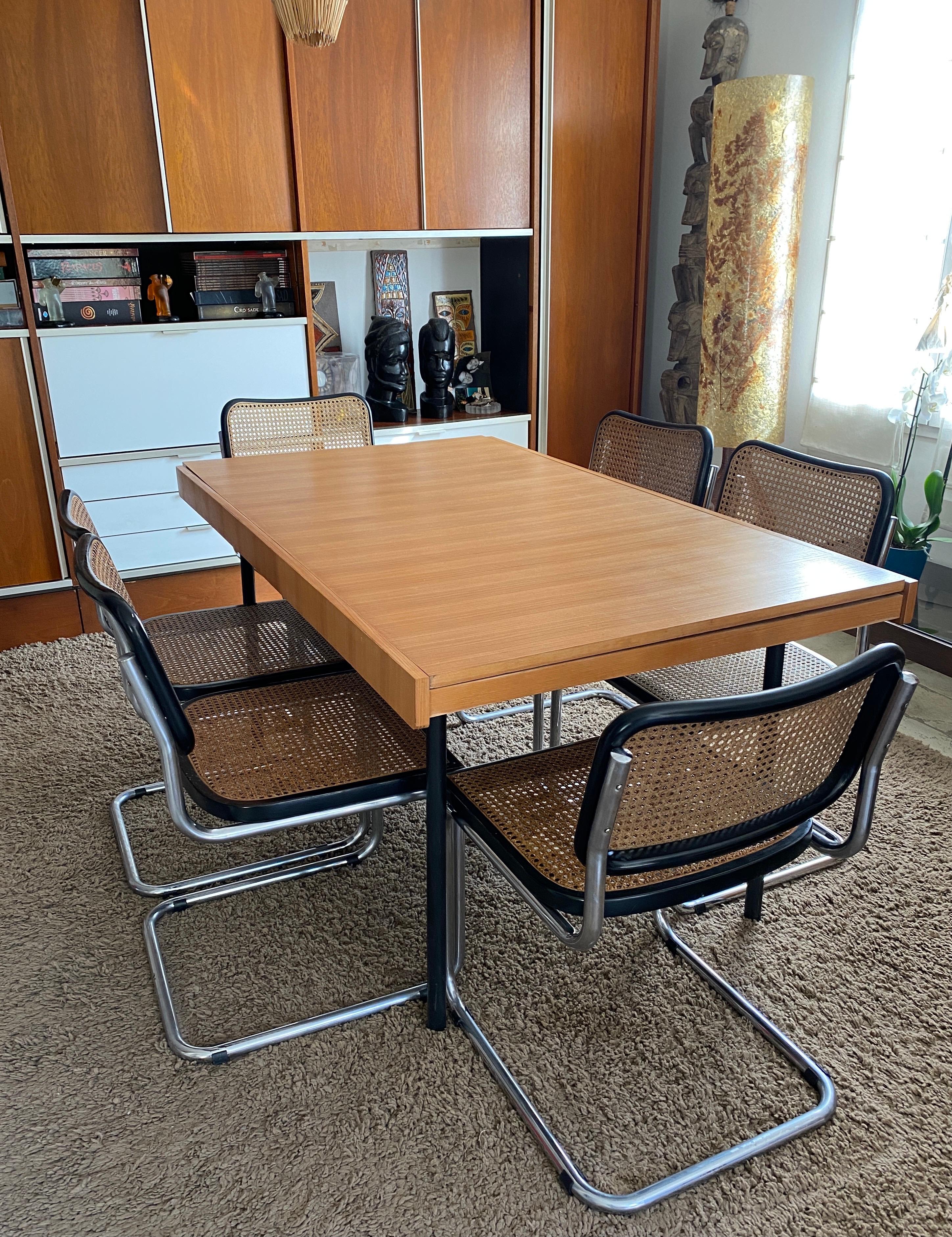 Table gérard guermonprez edition magnani, 1960 in elm with integrated 50cm extension tubular metal base. 150/200cm long /75 high and 89 wide good condition.
Gérard Guermonprez 20th-century French designer. He is known for his simple, functional