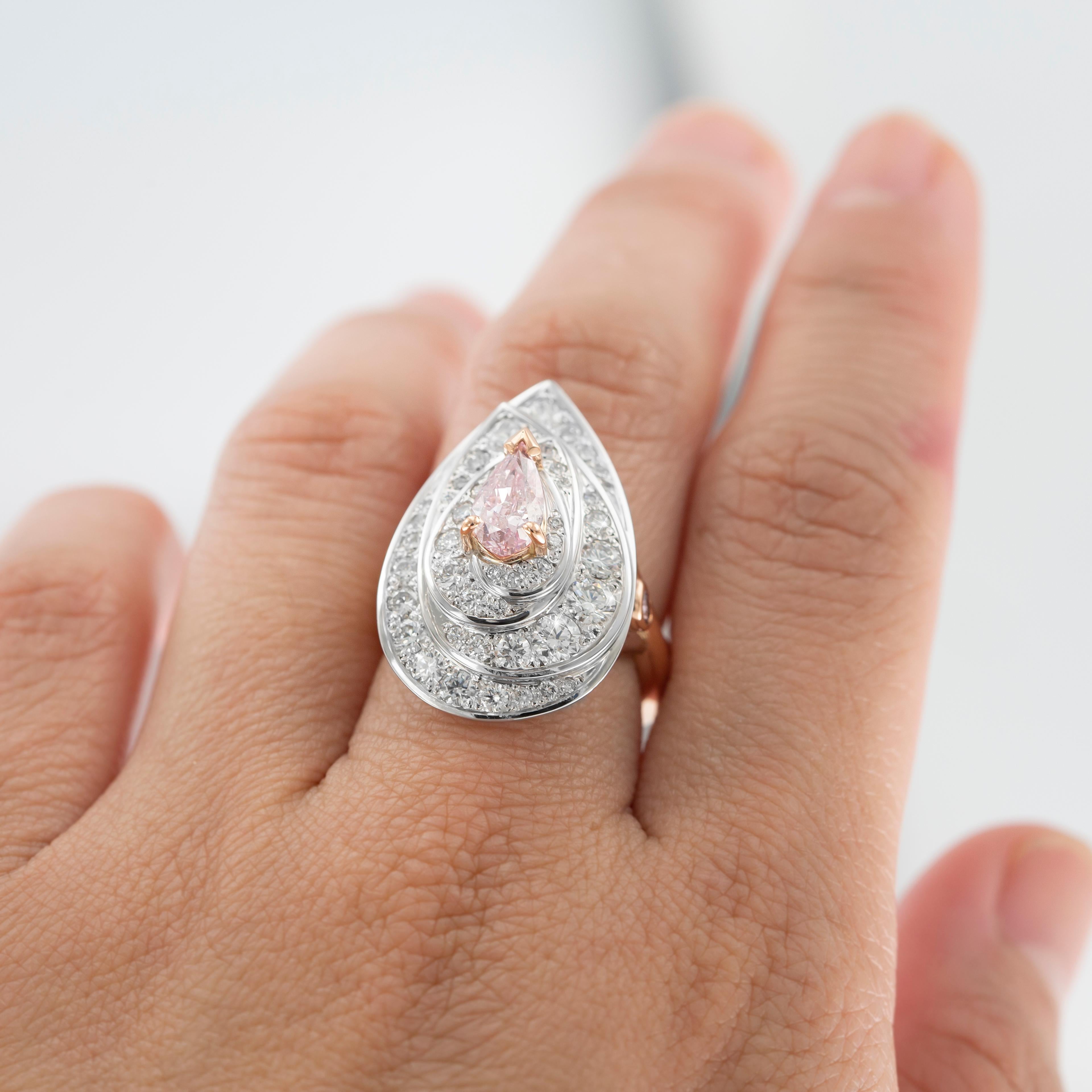 Love. It’s a powerful emotion in any language. The Amore pink and white diamond cluster ring draws upon the idea that love, through its support, and touch, has the power to transform all those that it connects with.

Through love, represented by the