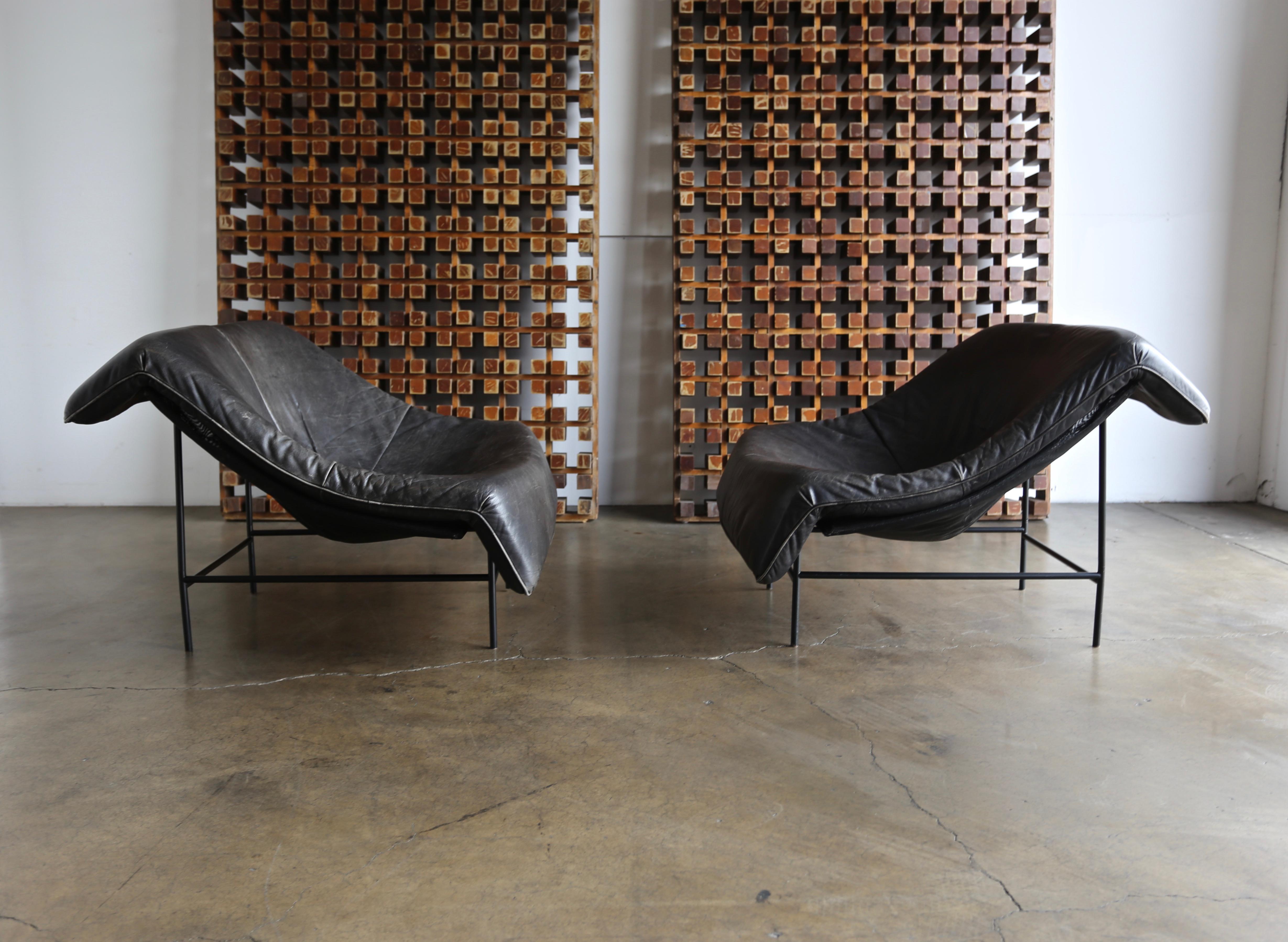 Gerard Van Den Berg butterfly chairs, circa 1983. This pair has a nice original patina. A very comfortable pair.