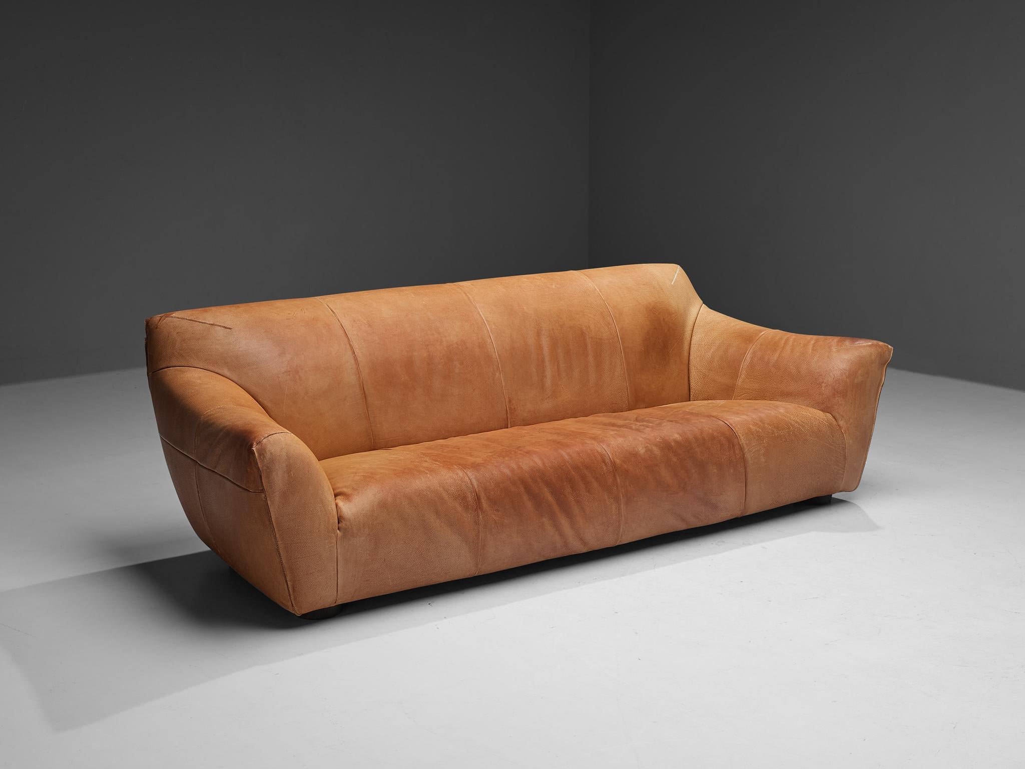 Gerard van den Berg for Label, sofa model 'Mancha', leather, The Netherlands, 1990s. 

This bulky three-seat 'Mancha' sofa is designed by the Dutch designer Gerard Van Den Berg. The sofa is comfortable and shaped as a large cushion, and also