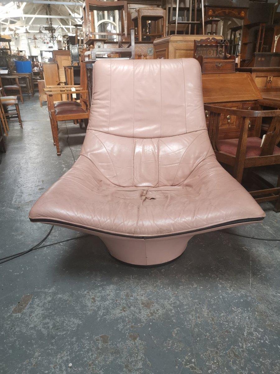 Gerard Van Den Berg for Montis, a pale pink 'Mantis' swivel armchair.
  