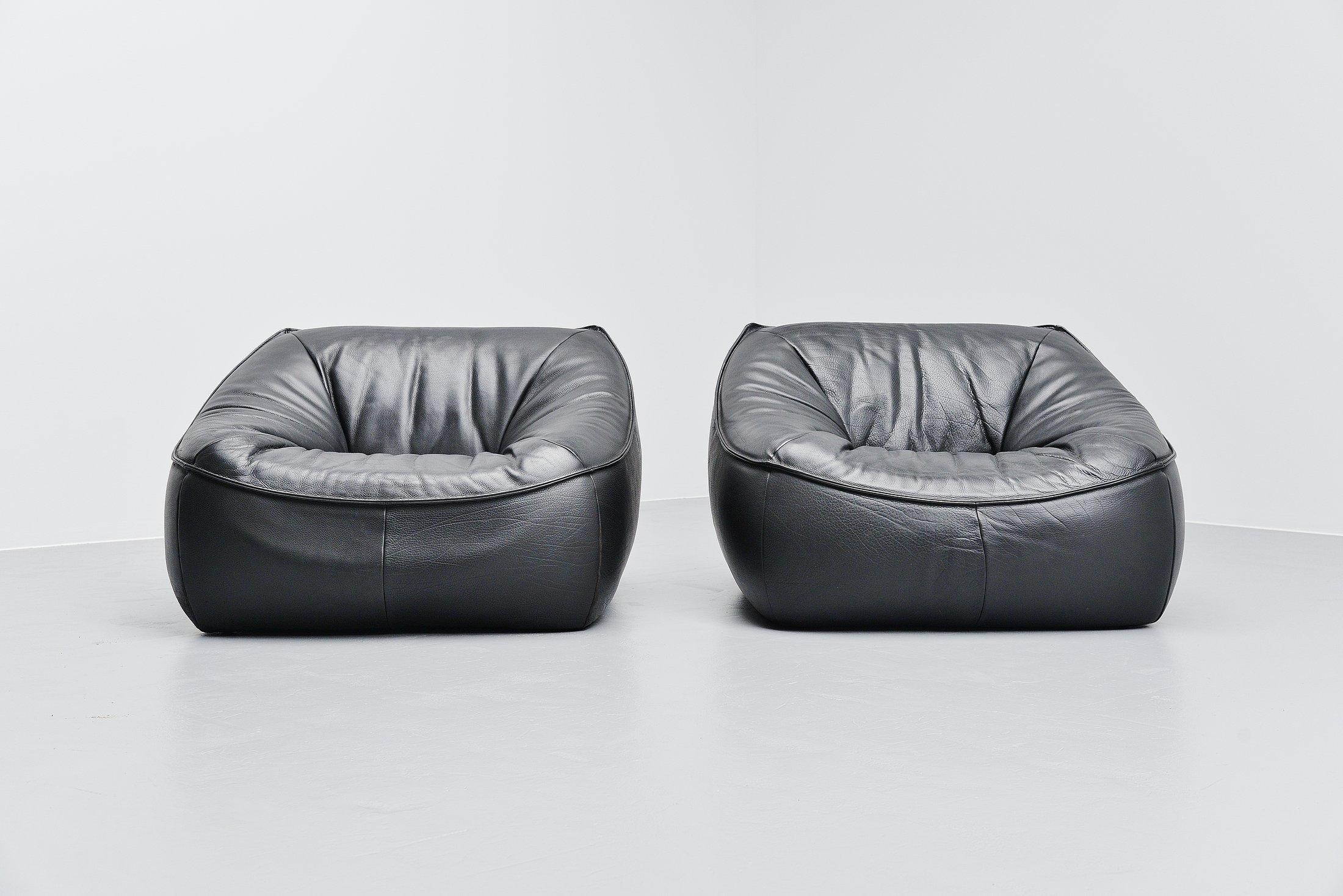 Fantastic pair of lounge chairs designed by Gerard van den Berg and manufactured by Montis, Holland 1970. The chairs are made of very thick black buffalo leather and have an amazing shape. Super comfortable set of lounge chairs and very hard to find