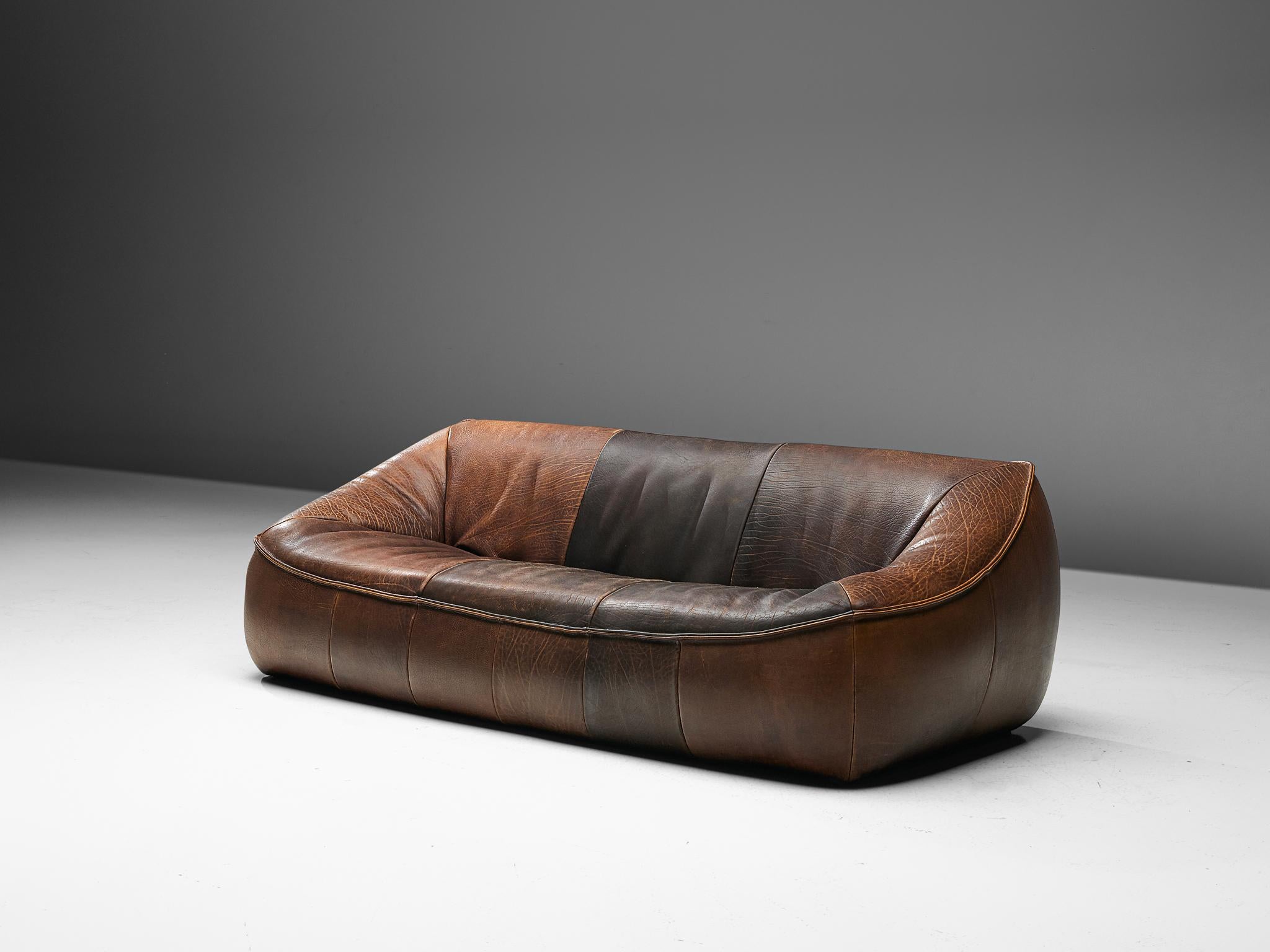 Gerard van den Berg 'Ringo' sofa for Montis, The Netherlands 1970s. 

Organic shaped sofa in brown De Sede quality leather. This sofa has an interesting design. It was designed as a large block of which the top is pressed inwards to create the