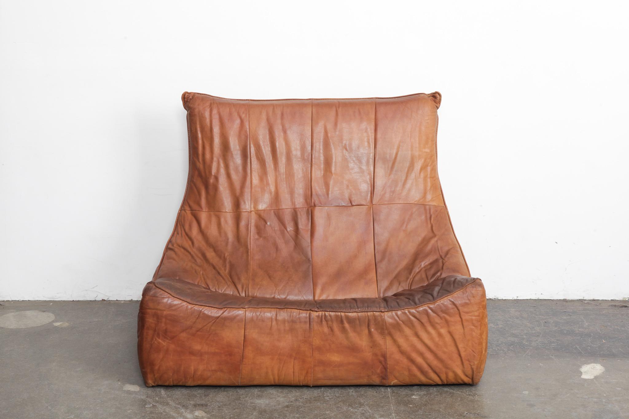 Leather tall back 'Rock Sofa' with nice patina, in cognac, designed by Gerard Van Den Berg for Montis, 1970s, Netherlands. Rear panel has been repaired/replaced shown in a photo below.