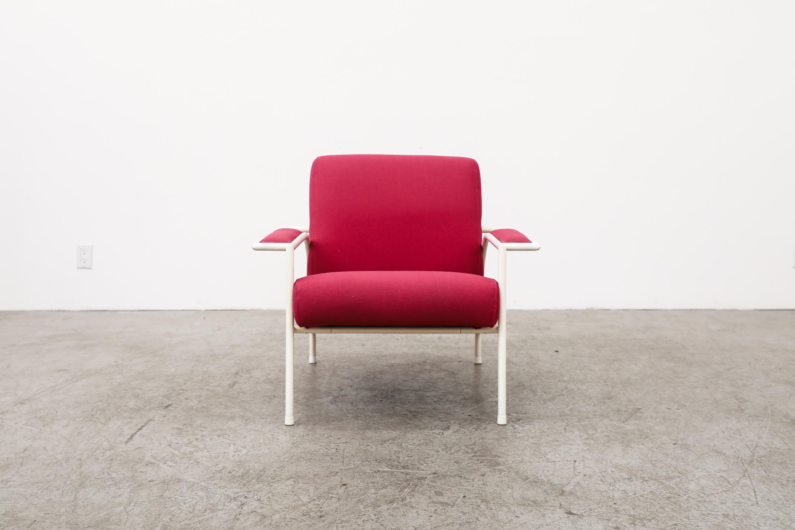 This 1980's lounge chair was designed by Gerard Vollenbrock for Gelderland with original pink upholstery and white enameled tubular metal frame. The chair is in original condition with some visible wear on frame, consistent with its age and use.