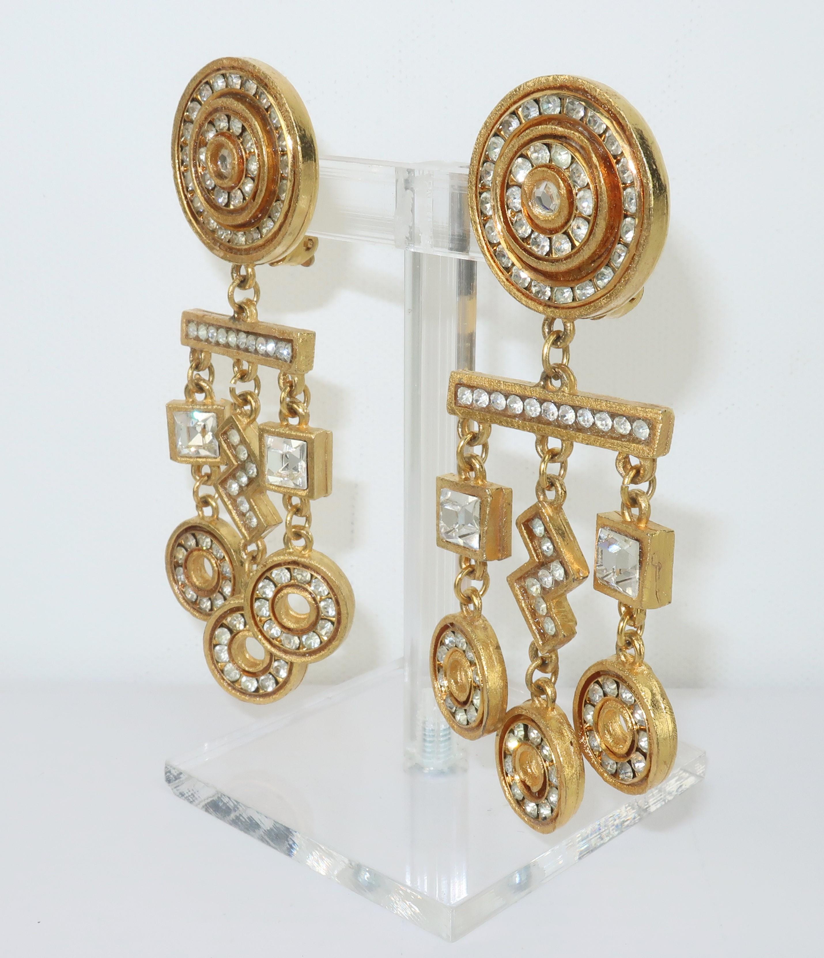 Gerard Yosca gold tone geometric dangle earrings accented by crystal rhinestones.  The statement making design has an Art Deco revival look.  Outfitted with clip on hardware and hallmarked to the back of each earring.
CONDITION
Very good vintage