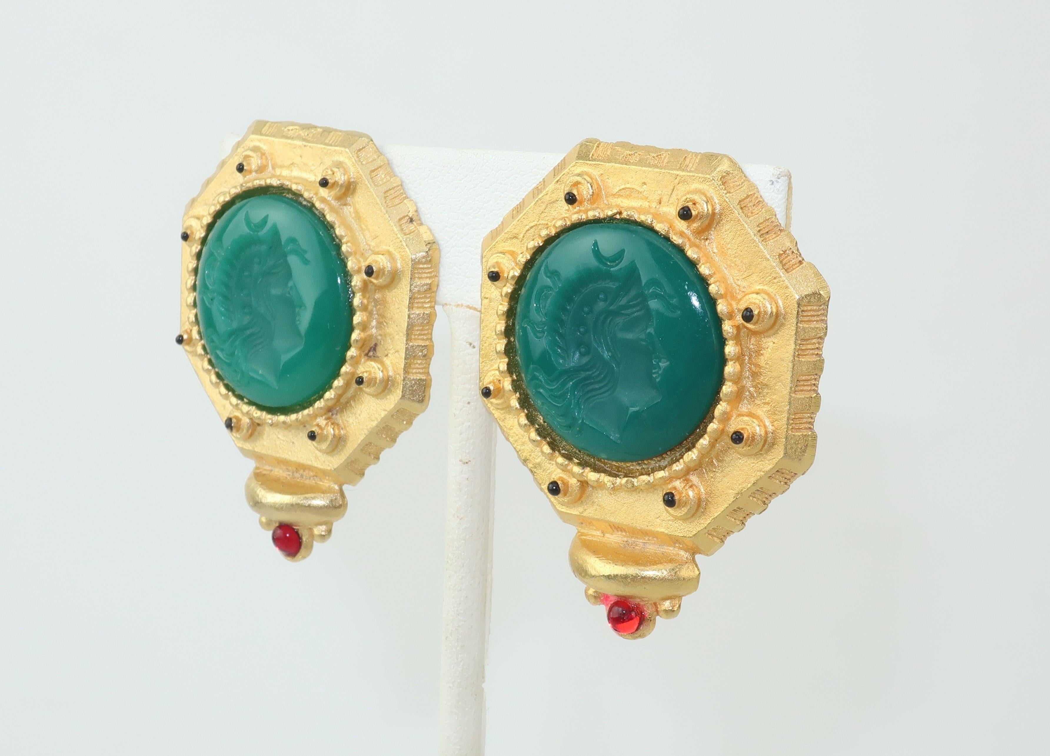 Handsome, stately and stylish!  These 1980's Gerard Yosca matte gold tone earrings have a neoclassical look with emerald green glass cameo style decorations featuring soldiers accented by black enamel and a red cabochon stone.  Outfitted with clip