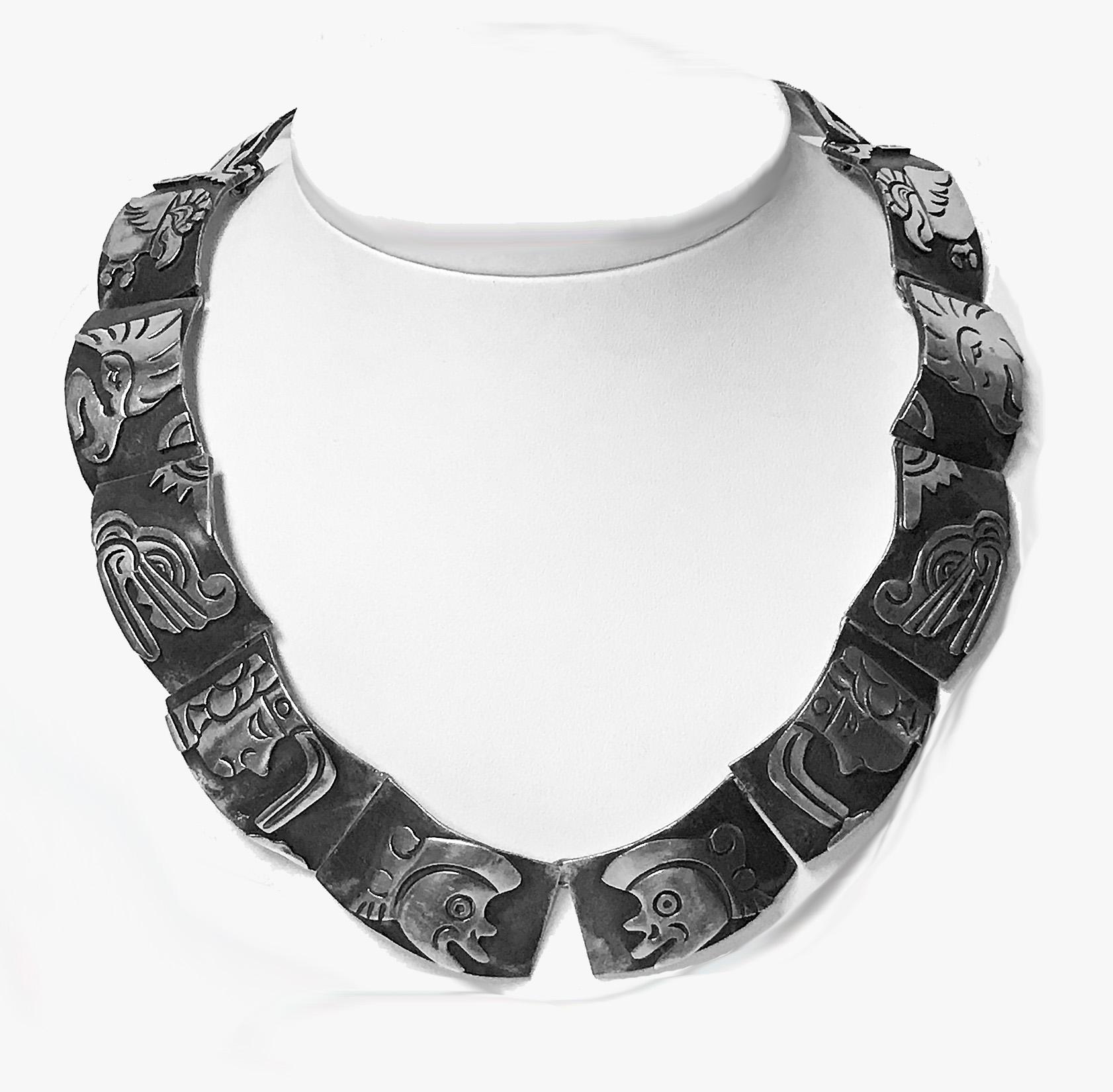 Gerardo Lopez Mexican 1950’s Sterling Silver Aztec Deity Necklace. The Necklace depicting Aztec Mythological Gods in polished silver applied to oxidized silver backgrounds. Signed Lopez Taxco, also marked Sterling 925 Hecho en Mexico and with eagle