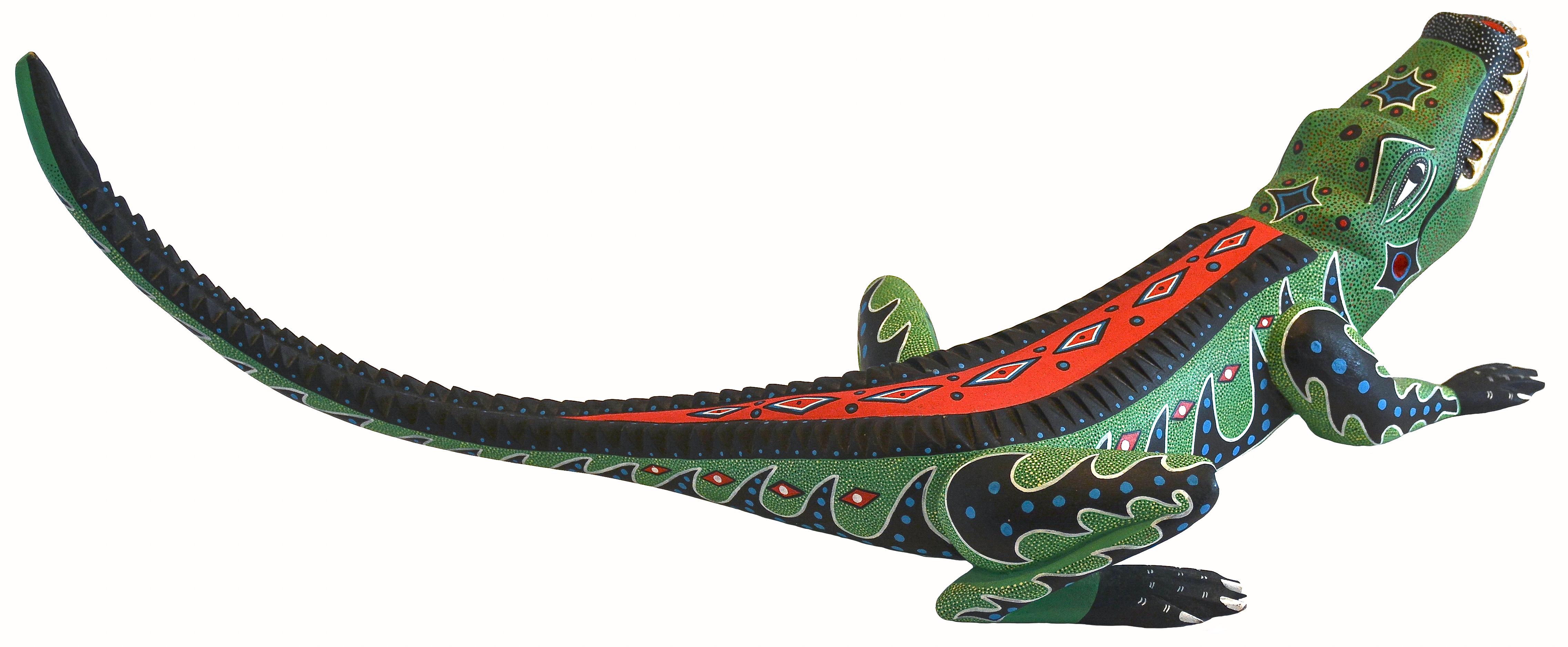 Alligator
1989
Gerardo Ramirez Morales
San Antonio Arrazola, Oaxaca, Mexico
Copal wood, acrylic paint
Signed
22.25 inches L. x 6.50 inches H. (at tail) x 8 inches W.

This amazing alligator is a rare vintage, near pristine exquisite example of