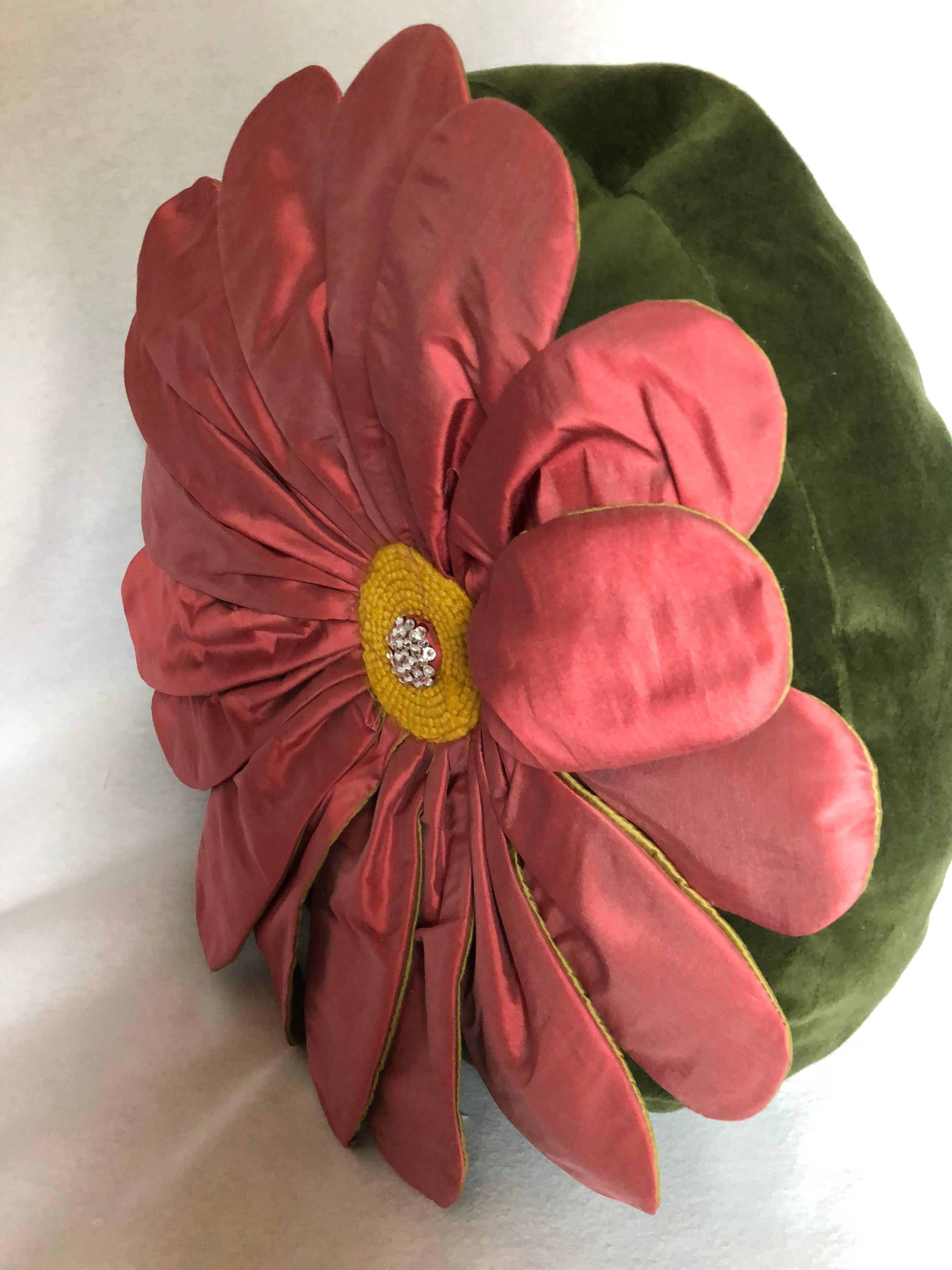 This pillow is another original design from Gantt Design Studio. Each pillow is made by hand in my studio. The Pink Gerber Daisy pillow is made of Yellow silk and Forest Green Velvet. Each silk petal is individually wired to hold its shape and allow