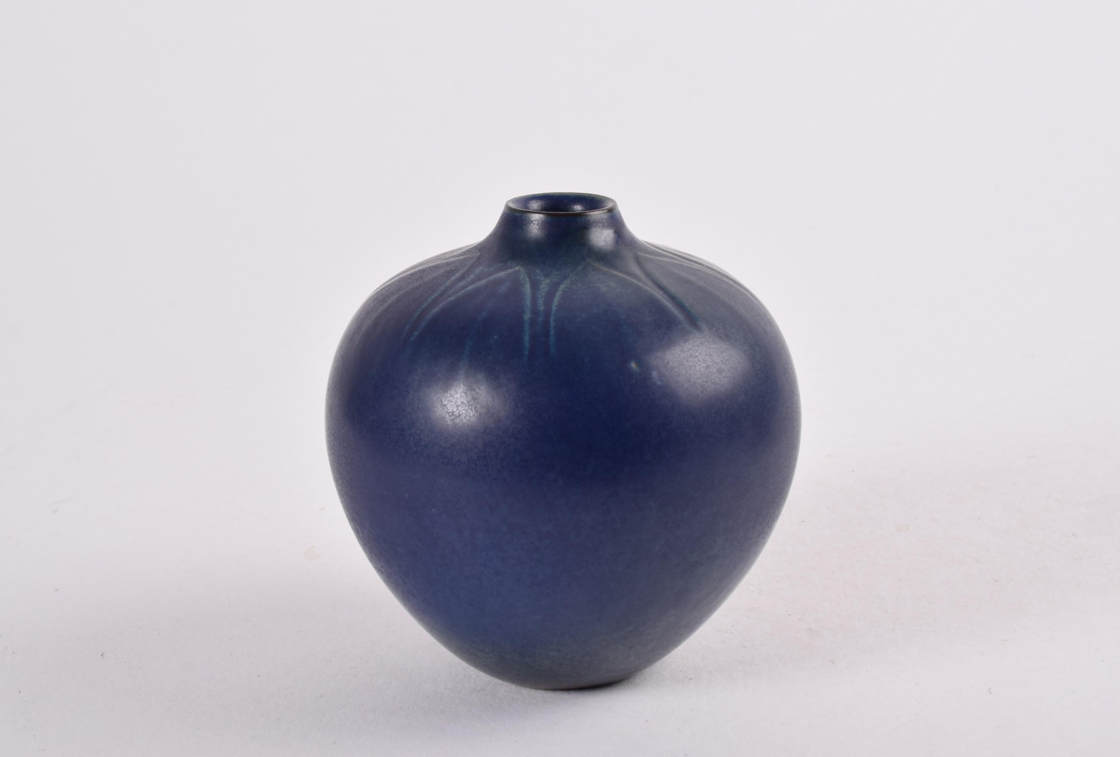 Vintage vase by Danish ceramist Gerd Bøgelund (1923-1987) for Royal Copenhagen Denmark. Made ca 1960s. 

The teardrop shaped vase has a blue glaze with minor green and blue elements and star decor on the shoulders.

Under the bottom it´s marked