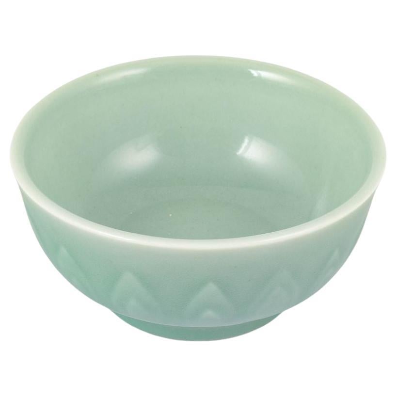 Gerd Bøgelund for Royal Copenhagen. Celadon-glazed bowl with relief decoration.