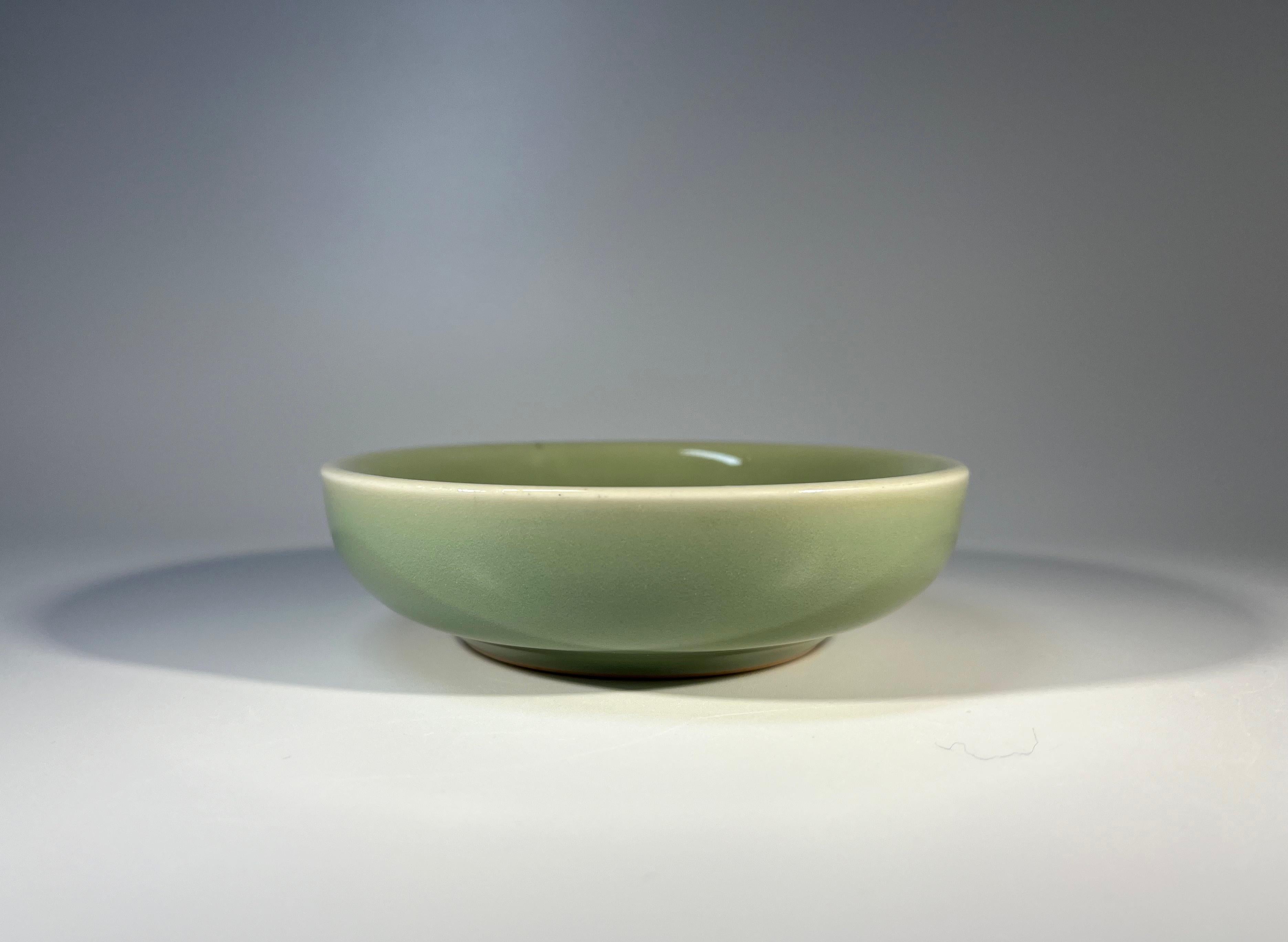 Elegant small celadon dish by Gerd Bøgelund for Royal Copenhagen 
Ageless design from the acclaimed Danish ceramicist
Circa 1959
Stamped and numbered 21415
Height 1.25 inch, Diameter 4.5 inch
In very good condition. Small firing fault on rim
Wear