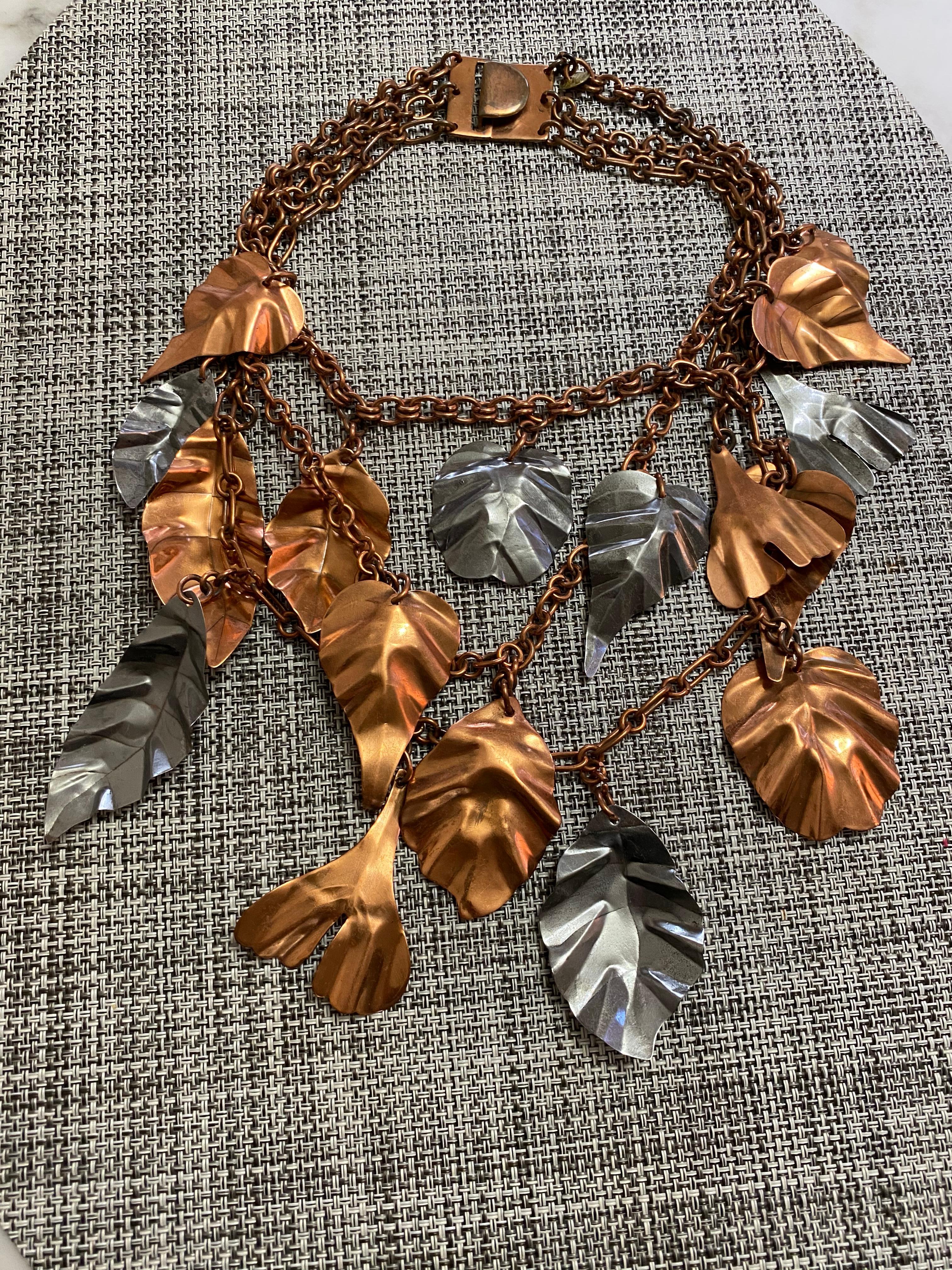 Rare and unique Gerda Lynggaard leaves necklace. What a statement jewelry. 
Necklace has three strands of chain and layer with bronze and silver leaf pendant.
see measurement on picture attached.
