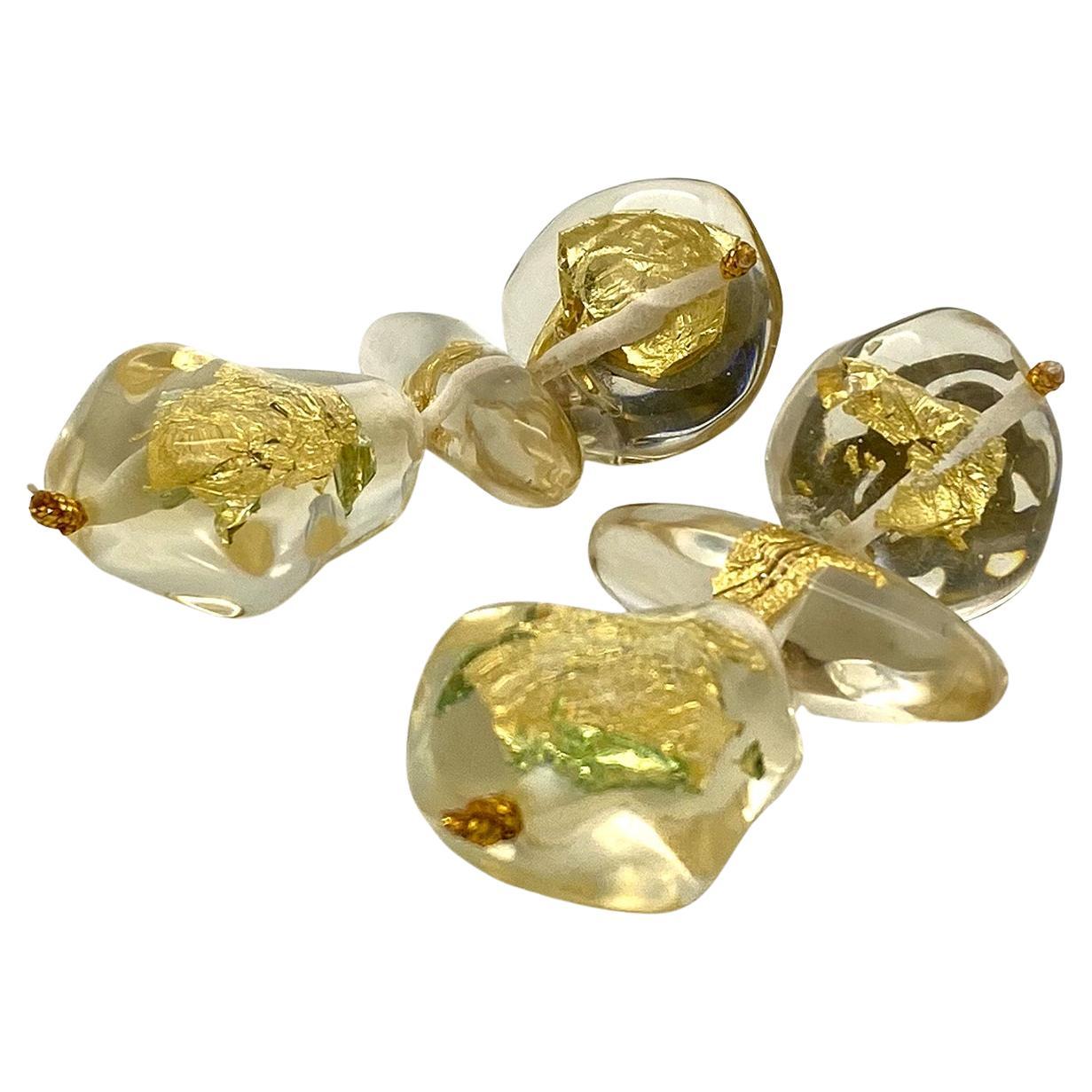 This is Copenhagen designer Gerda Lynggaard's hand made earrings for Monies, They sell through Palais Royal and a boutique in Milan. This pair of dangle earrings looks like a pair of dancing girls and is made with clear Lucite and has gold foil