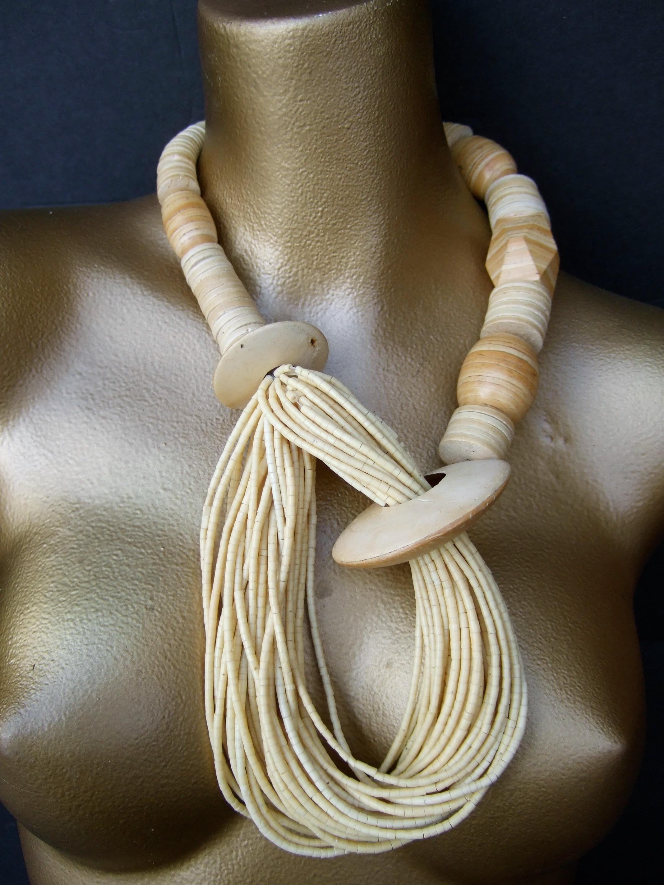 Gerda Lynggaard Monies Massive chunky wood design artisan necklace c 1980s
The bold large scale statement necklace is designed with a collection
of various size & shaped natural wood beads

Makes a striking bold accessory

Measurements: 
The