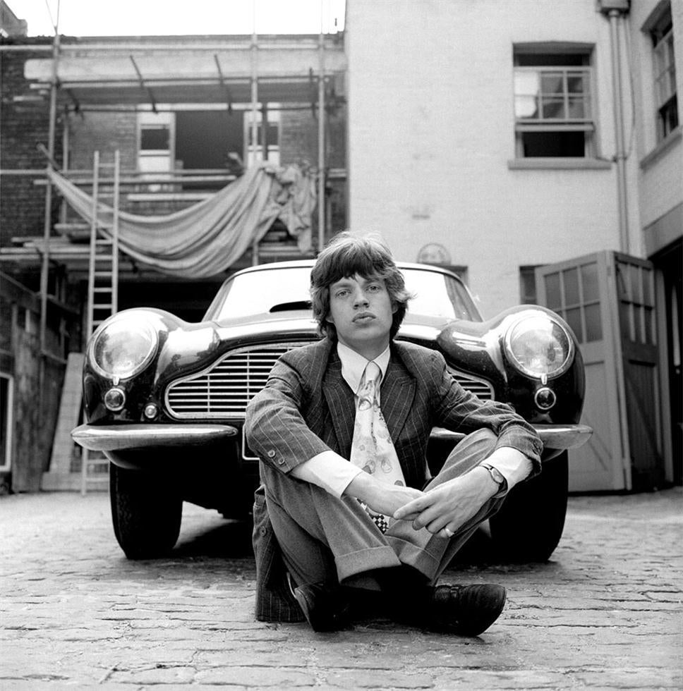 Gered Mankowitz Black and White Photograph - Mick Jagger, Aston Martin, 1966