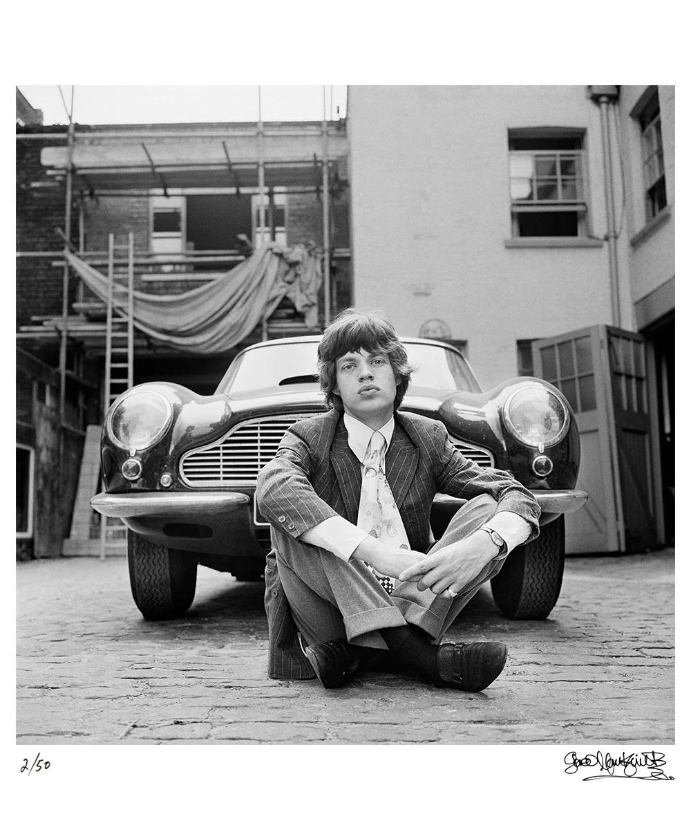 Mick Jagger with his Aston Martin DB6, 1966 — Signed Limited Edition Print - Photograph by Gered Mankowitz