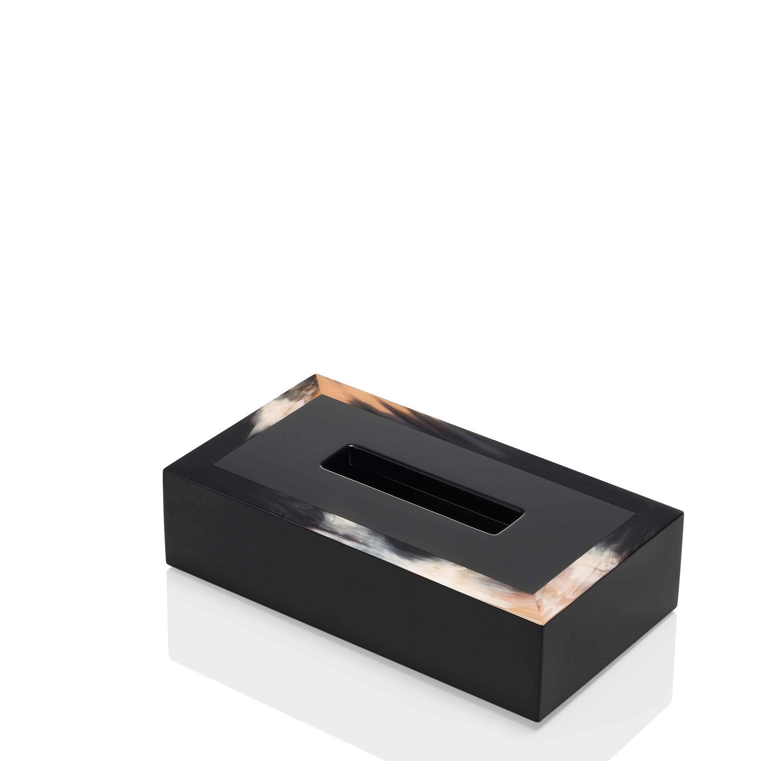 Dreamy hues and sleek design come together in our Geremia tissue box holder. Crafted of black lacquered wood with a high-gloss finish, it boasts unique details in Corno Italiano, rich in texture and warmth, elevating this everyday item into a luxury