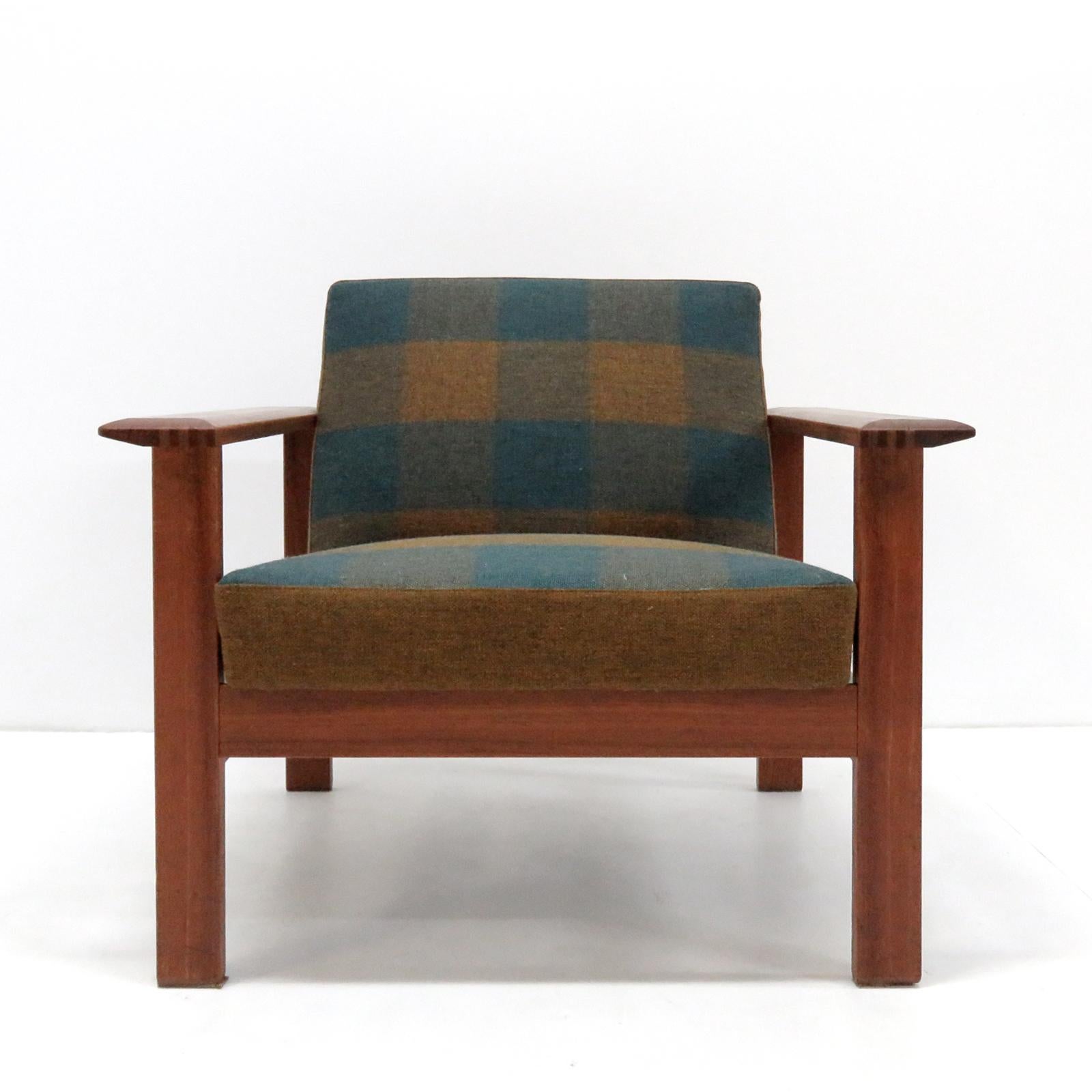 Bold and comfortable Danish modern lounge chairs by Gerhard Berg for Stokke, Norway, 1960s, oversized teak frames with original multicolored tartan fabric in green-blue hues.