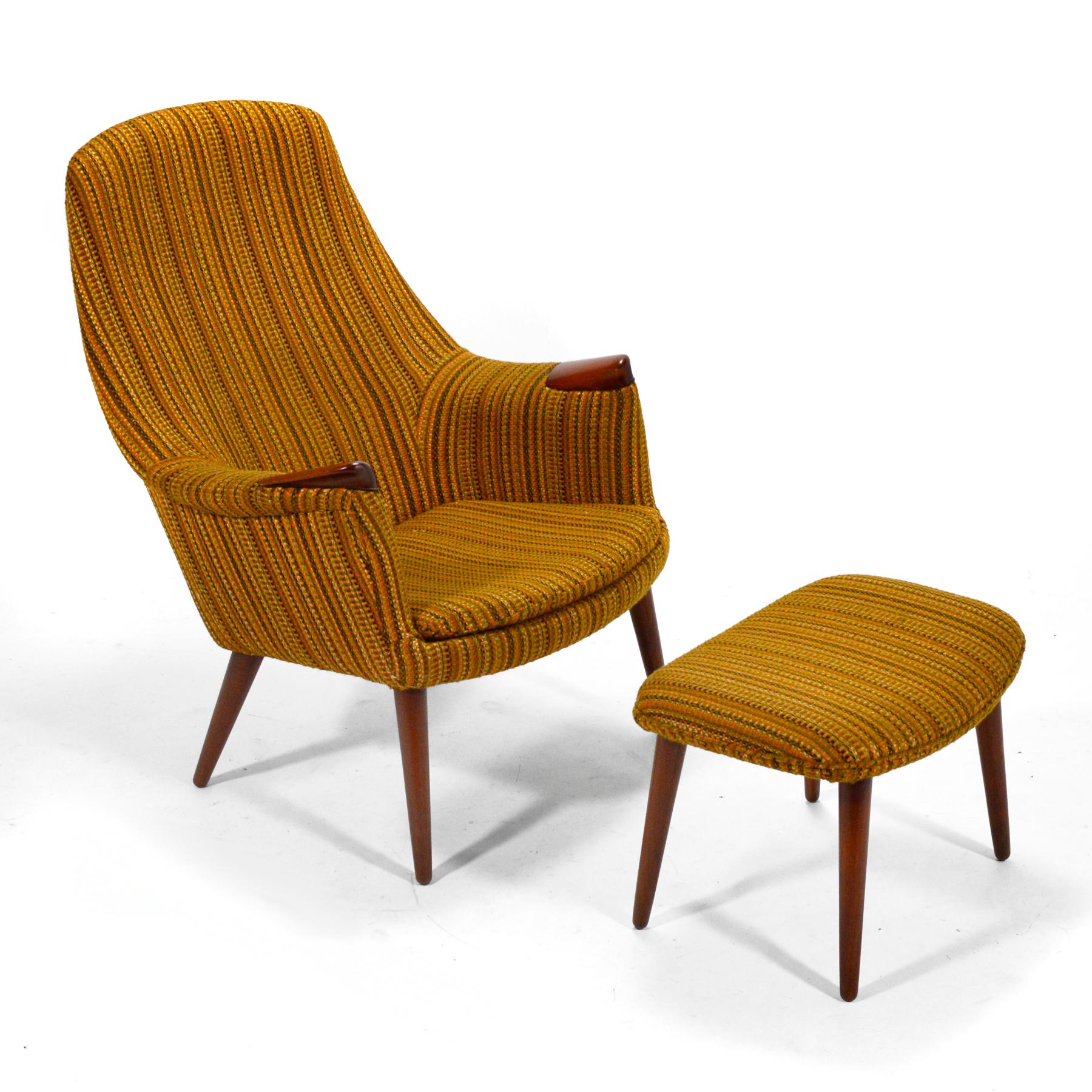 This striking lounge chair and ottoman designed by Gerhard Berg for LK Hjelle in Norway shares qualities with some Hans Wegner designs. It has an upholstered body with exposed teak hand-rests and is supported by elegant tapered teak legs. With sexy