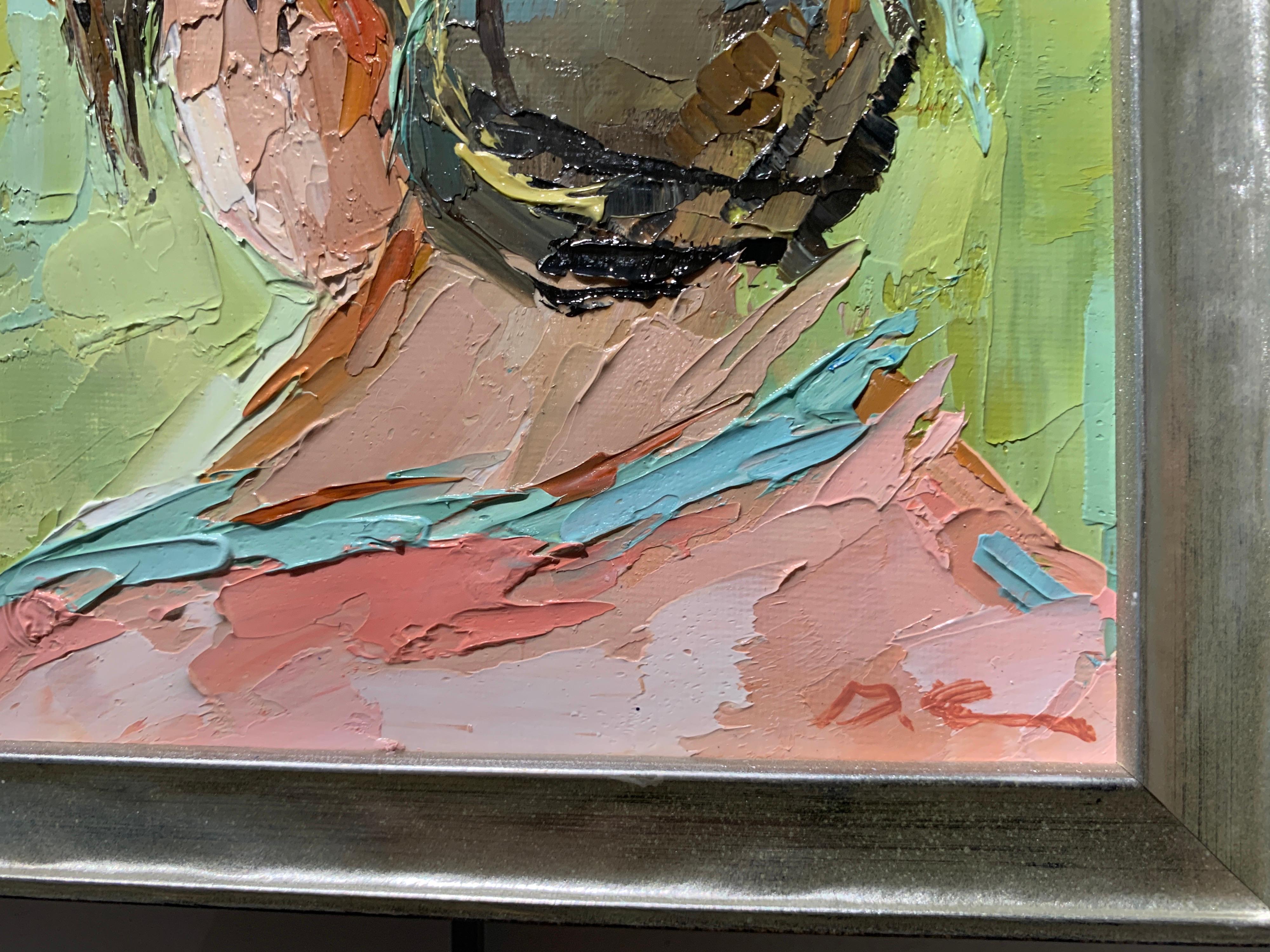 'Head Portrait' is a petite framed oil on canvas Impressionist painting created by American artist Geri Eubanks in 2021. Featuring a vibrant palette made of blue, pink, coral, green, brown, off-white and black tones, this small figurative painting