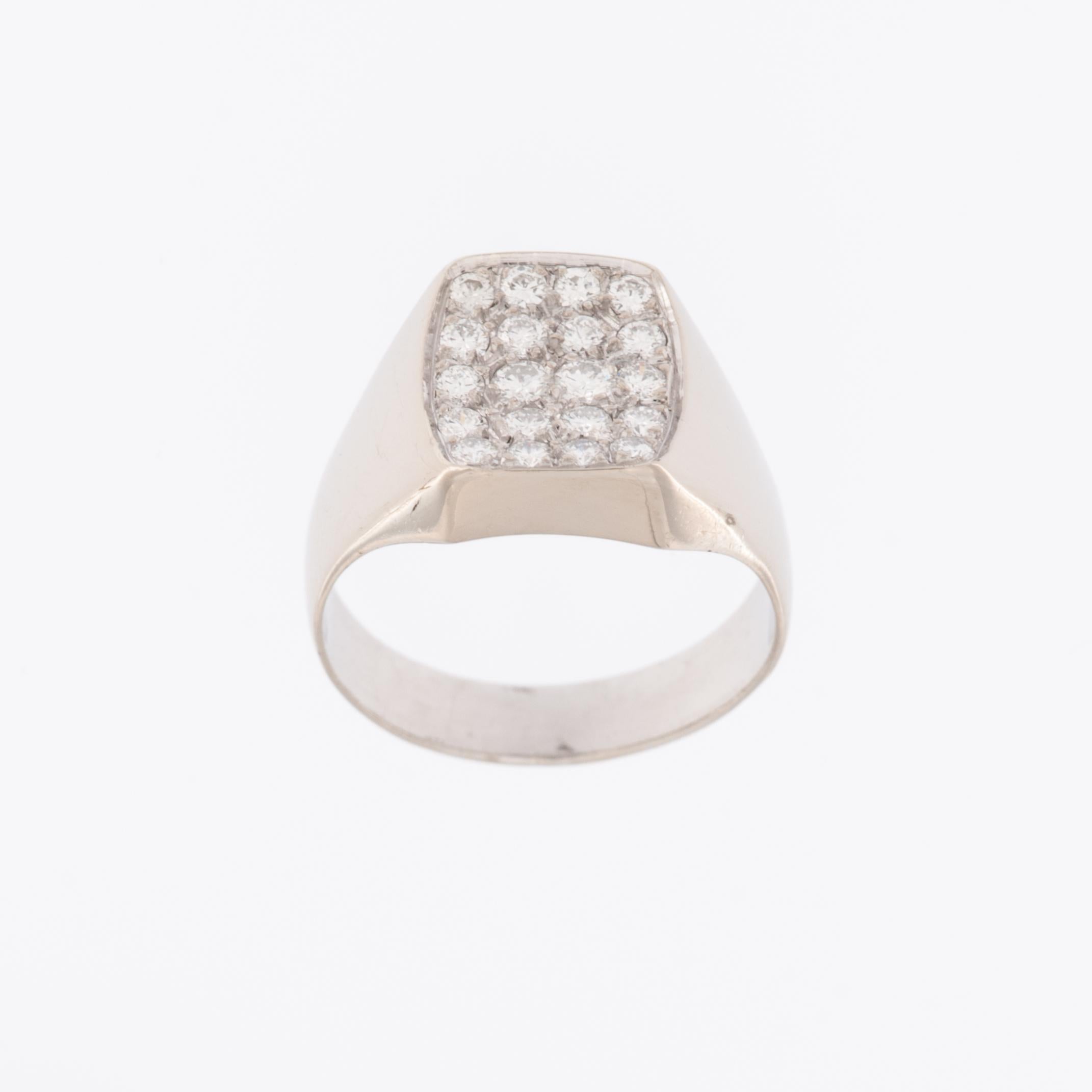 The German 18kt White Gold Signet Ring with Diamonds is a luxurious and stylish piece of jewelry that combines the classic elegance of white gold with the sparkling beauty of diamonds. 

The ring is crafted from 18-karat white gold, a high-quality