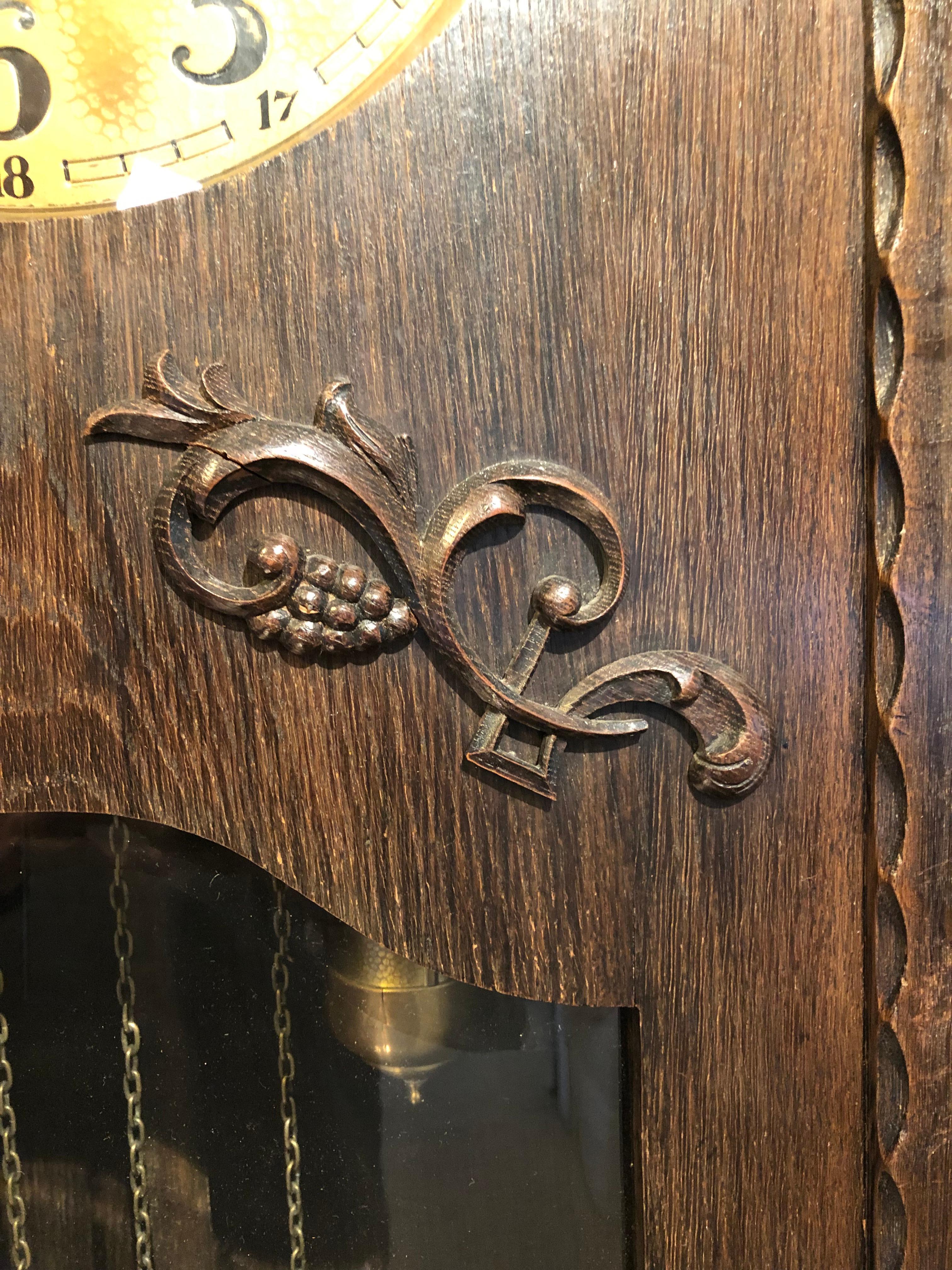 A handsome 1920s German grandfather clock with hammered brass dial 

Domed glass over face, beveled glass over case 

Running very well and in good condition.