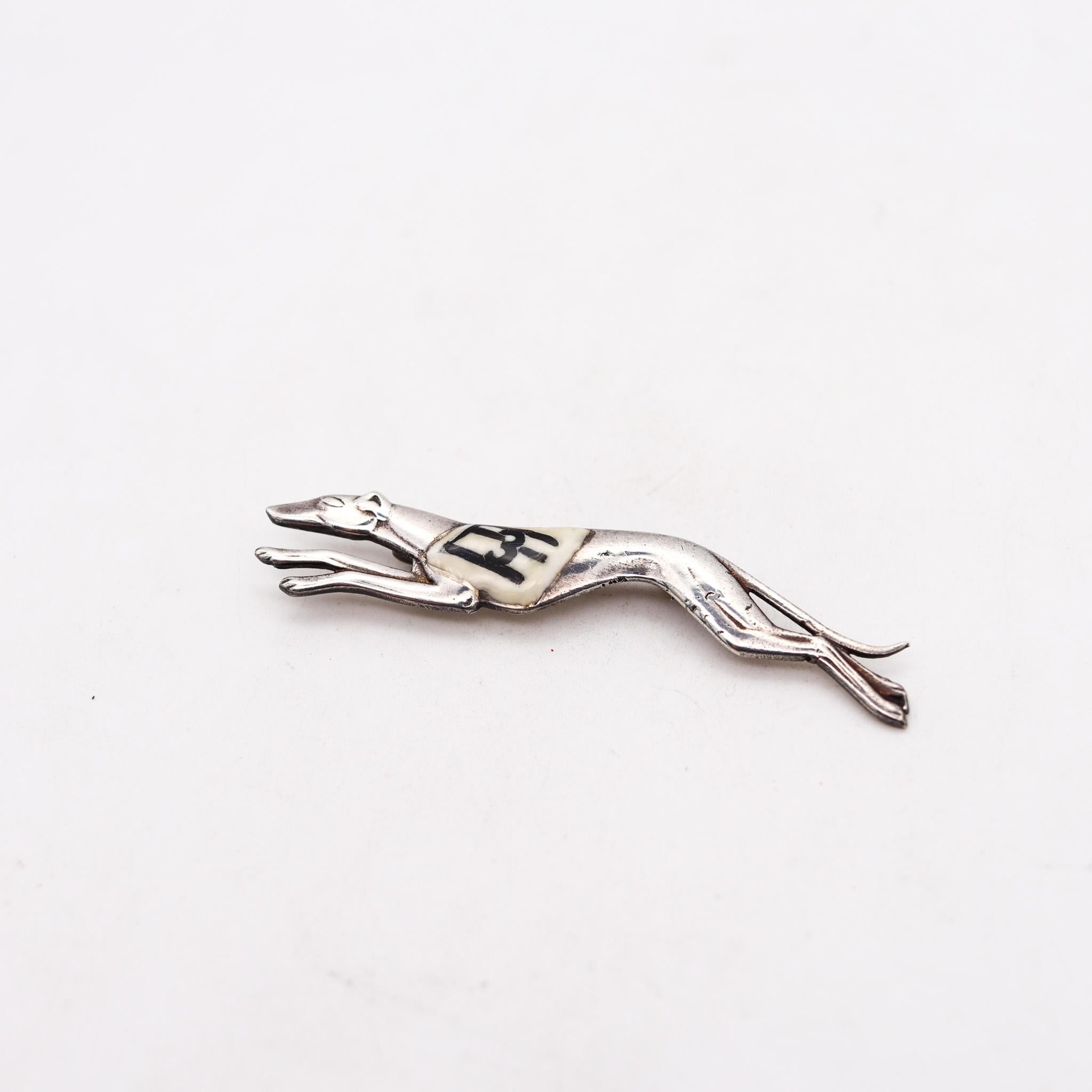Art Deco greyhound dog brooch with number 3.

Beautiful and very stylish greyhound dog brooch, created in Germany during the art deco period, back in the 1925. This brooch has been designed with very stylized patterns and crafted in solid .925/.999