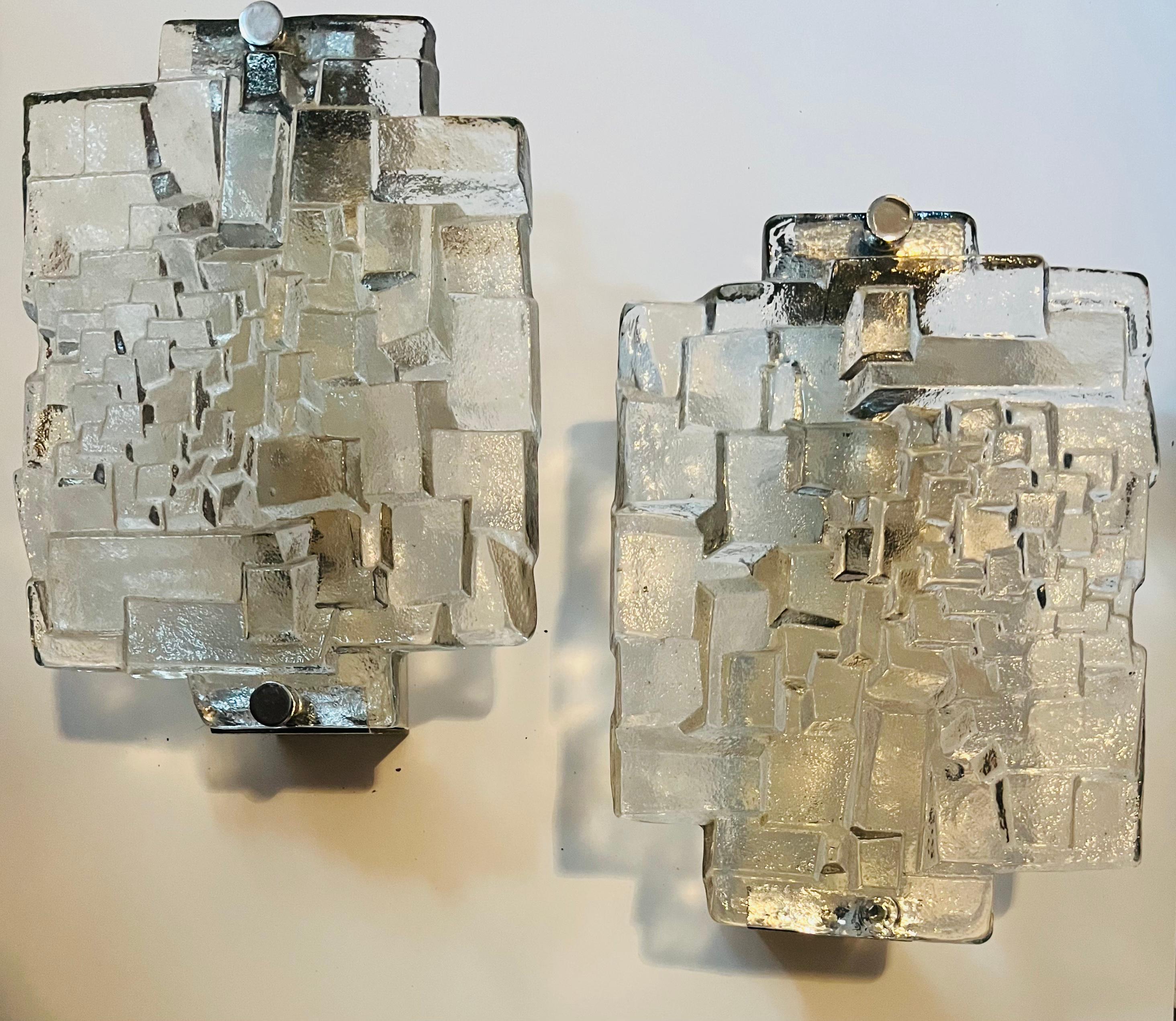 A great pair of 1960s thick textured glass sconces with chrome fittings by the lighting company, Hillebrand. Rewired.