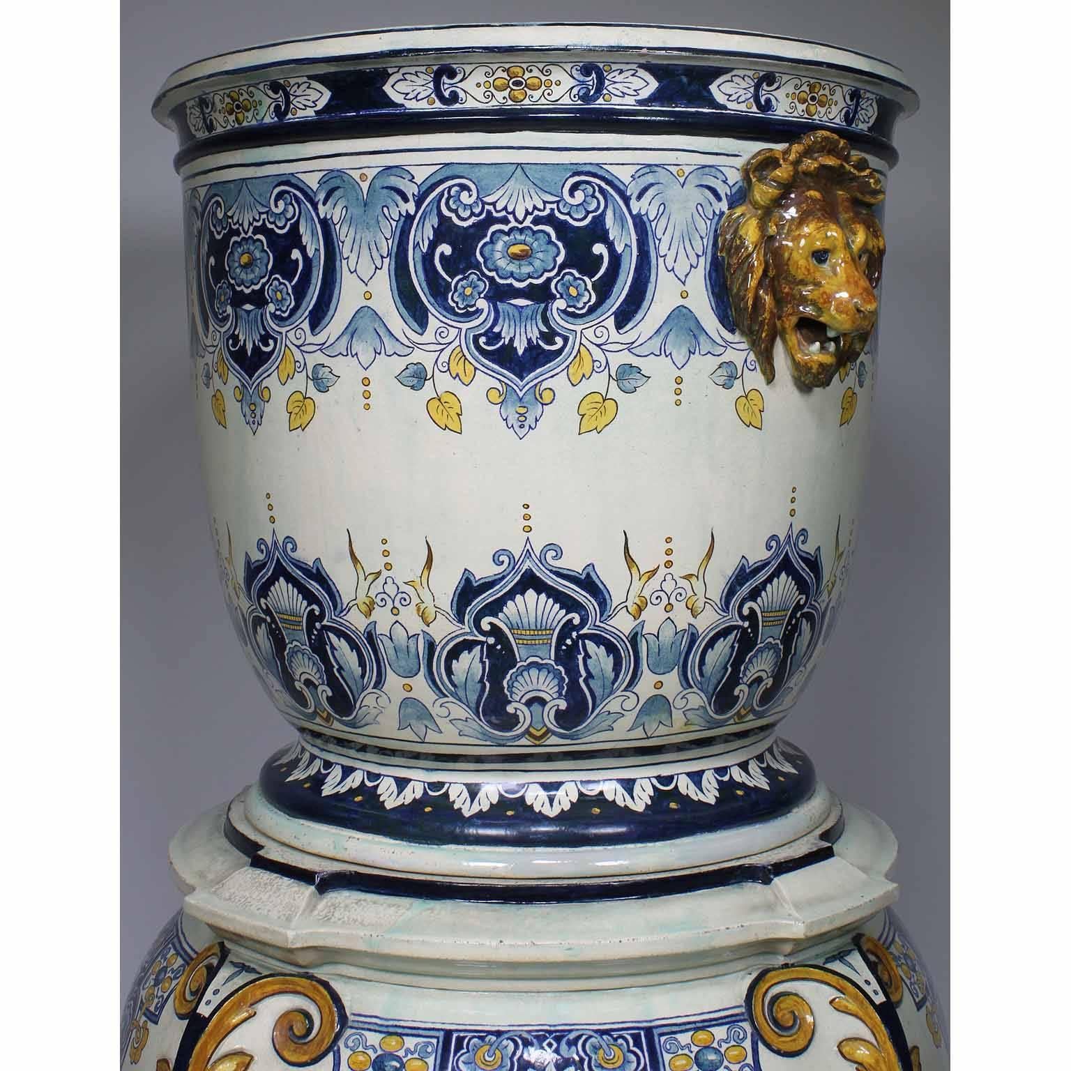 A large and impressive German 19th century neoclassical Revival style majolica ceramic jardinière planter on stand in the manner of Villeroy & Boch. The overall polychrome decorated tapering cylindrical cachepot vessel with foliage and anthemion in