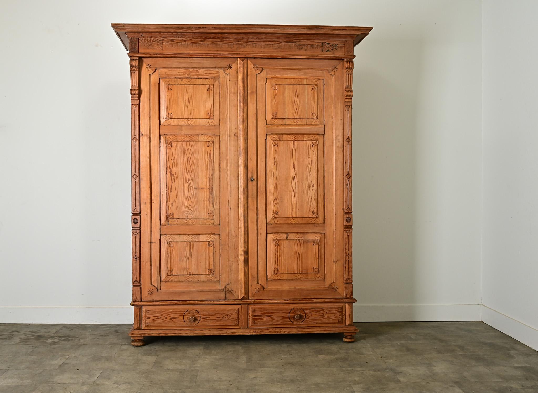 This massive antique oak armoire was crafted in the early 19th century in present-day Germany. Apart from the scale, the most curious and unique feature is the inspirational phrase carved into the frieze, roughly translating to: “What is easily