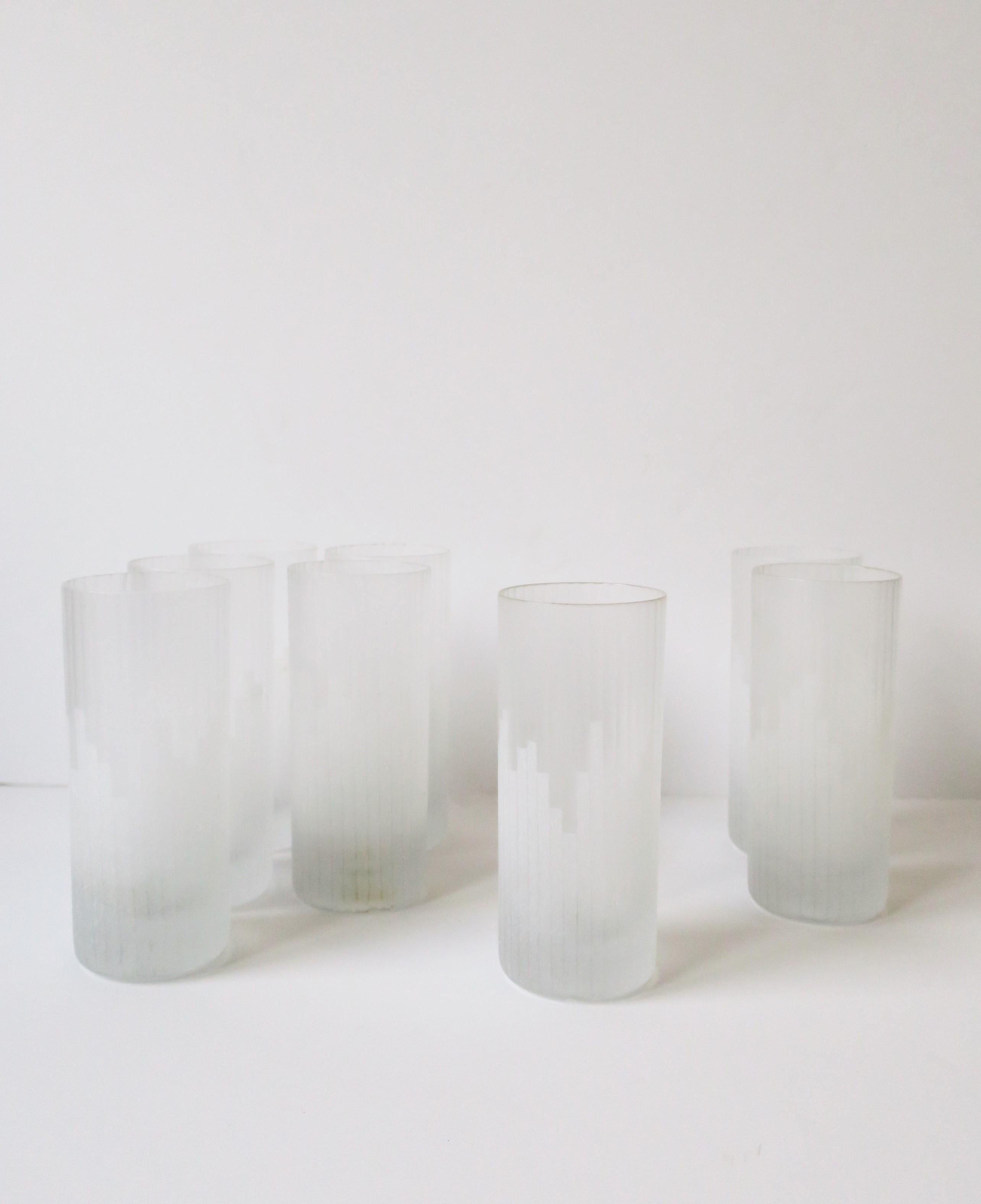 A very beautiful and rare set of eight (8) '70s Modern highball cocktail glasses by Carl Rotter Lubeck, circa 1970s, late-20th century, West Germany. Glasses have a Modern/Art Deco cityscape design on a matte glass with fluted design. A great set