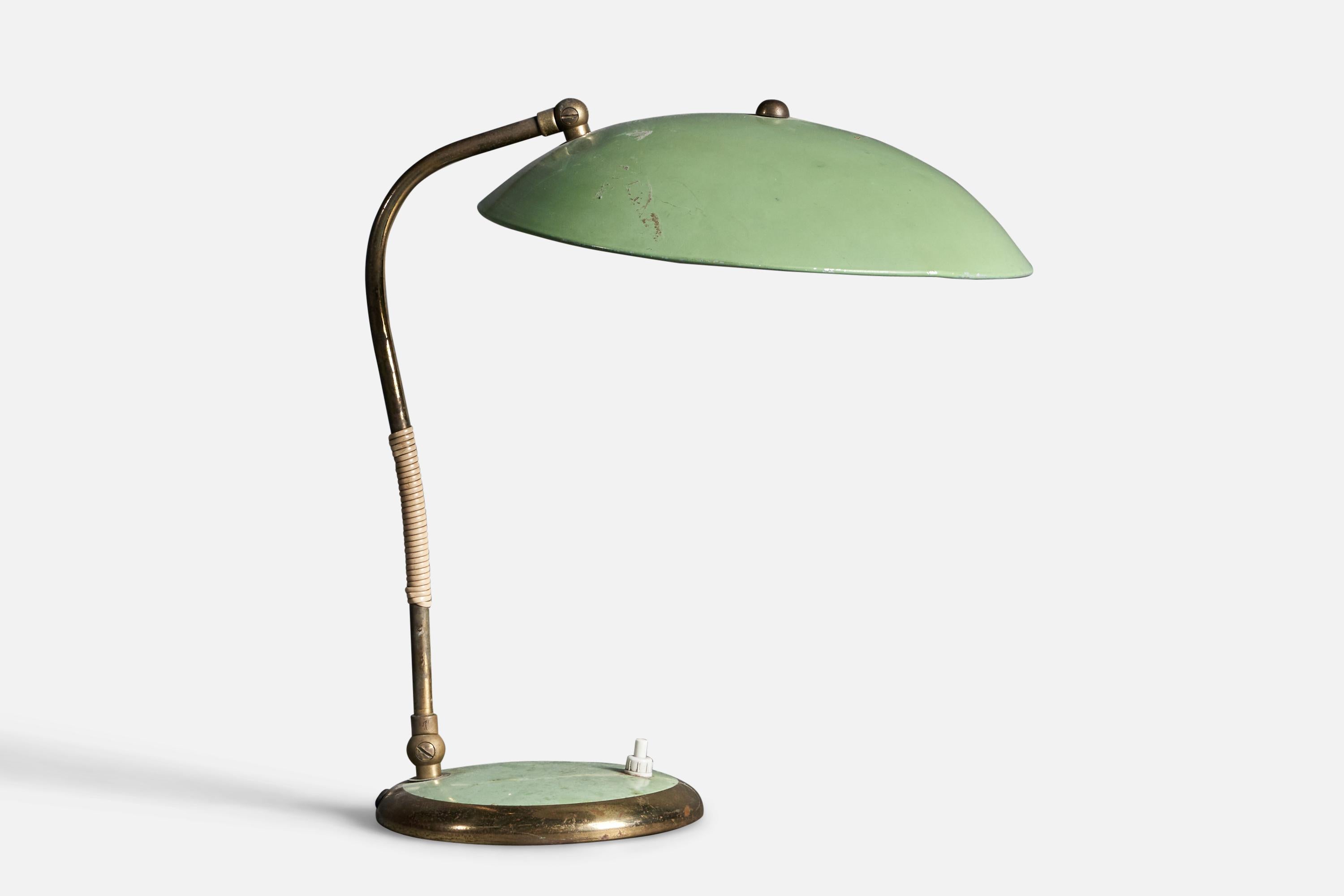 An adjustable table lamp / desk light. Germany, 1950s.

Features brass and green-lacquered metal.

