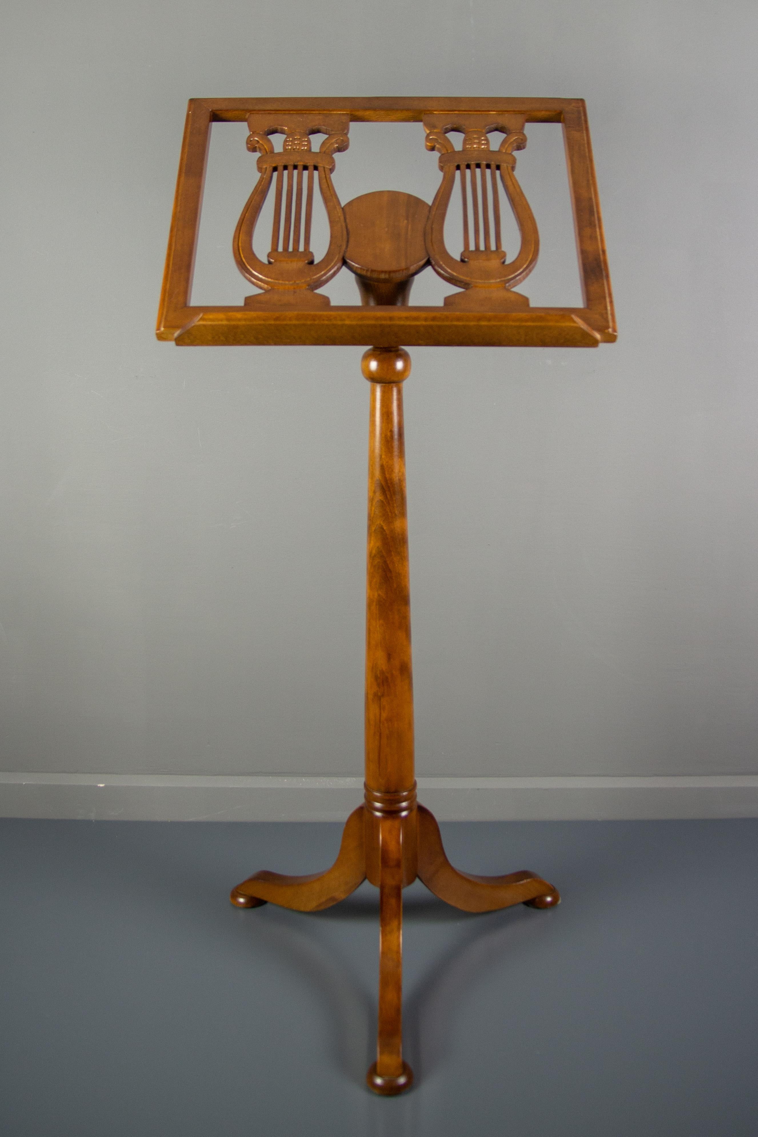 An elegant and beautiful wooden music stand with adjustable height on a tripod base. Nicely decorated with two lyres, it will accommodate sheet music or books, Germany, 1930s-1940s.
Dimensions:
Height, adjusted to the highest position 140 cm /