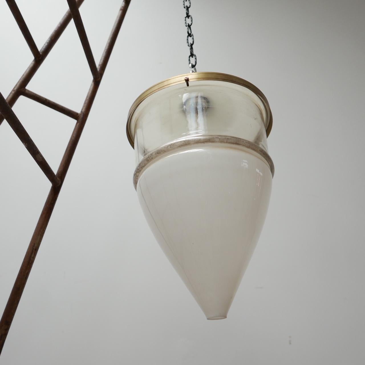 A large antique pendant light. 

Stamped Jena. 

German, c1910. 

Highly unusual and rare lamp, the two base parts of the lamp are pressed glass over the rim rather than using a metal rim which is the normal way of attaching glass. 

The