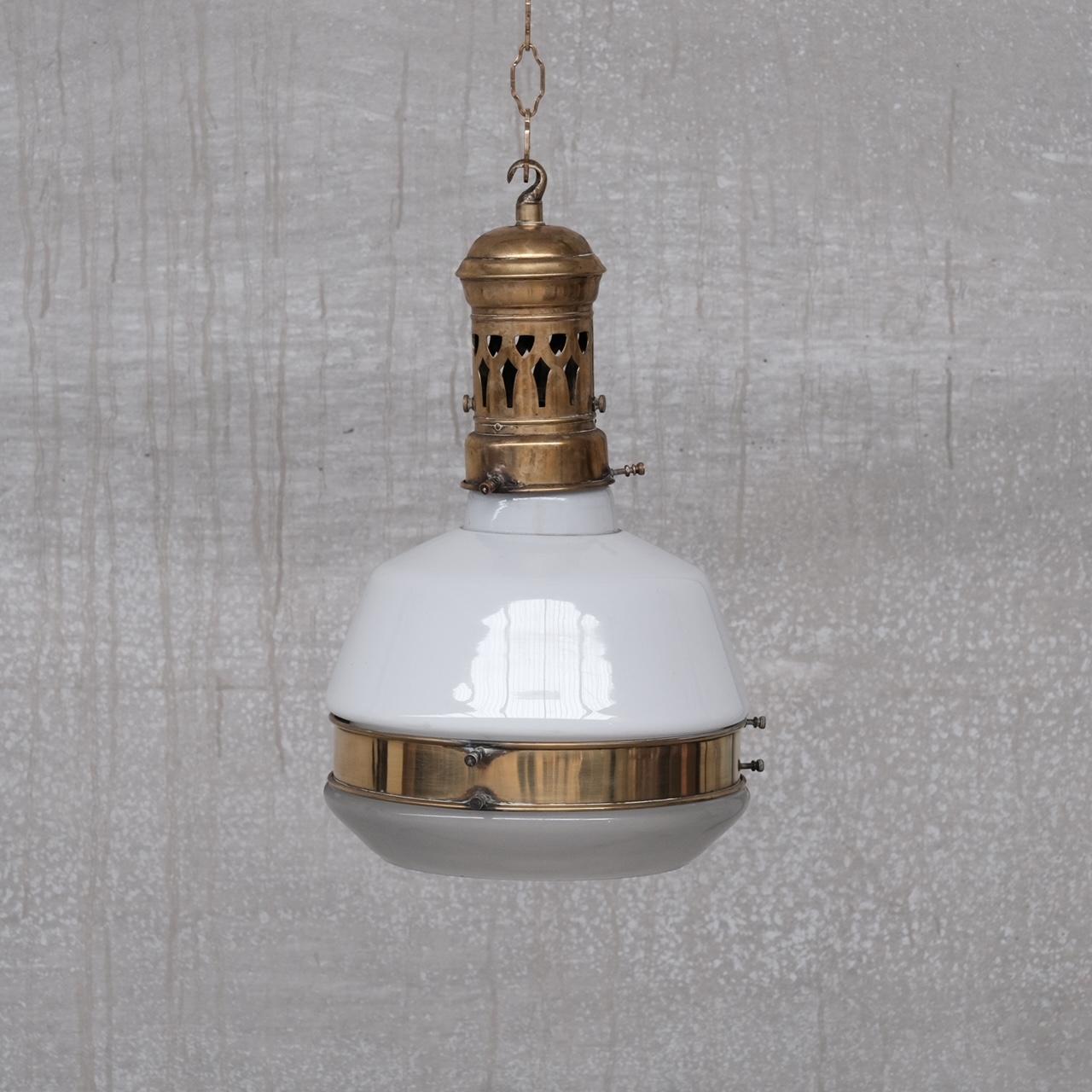 A good quality brass and glass pendant light. 

Germany, c1910. 

Brass gallery and rim. 

Opaline glass top and etched glass open base. 

Since re-wired and PAT tested. 

Location: London Gallery.

Dimensions: 27 Diameter x 43 Total