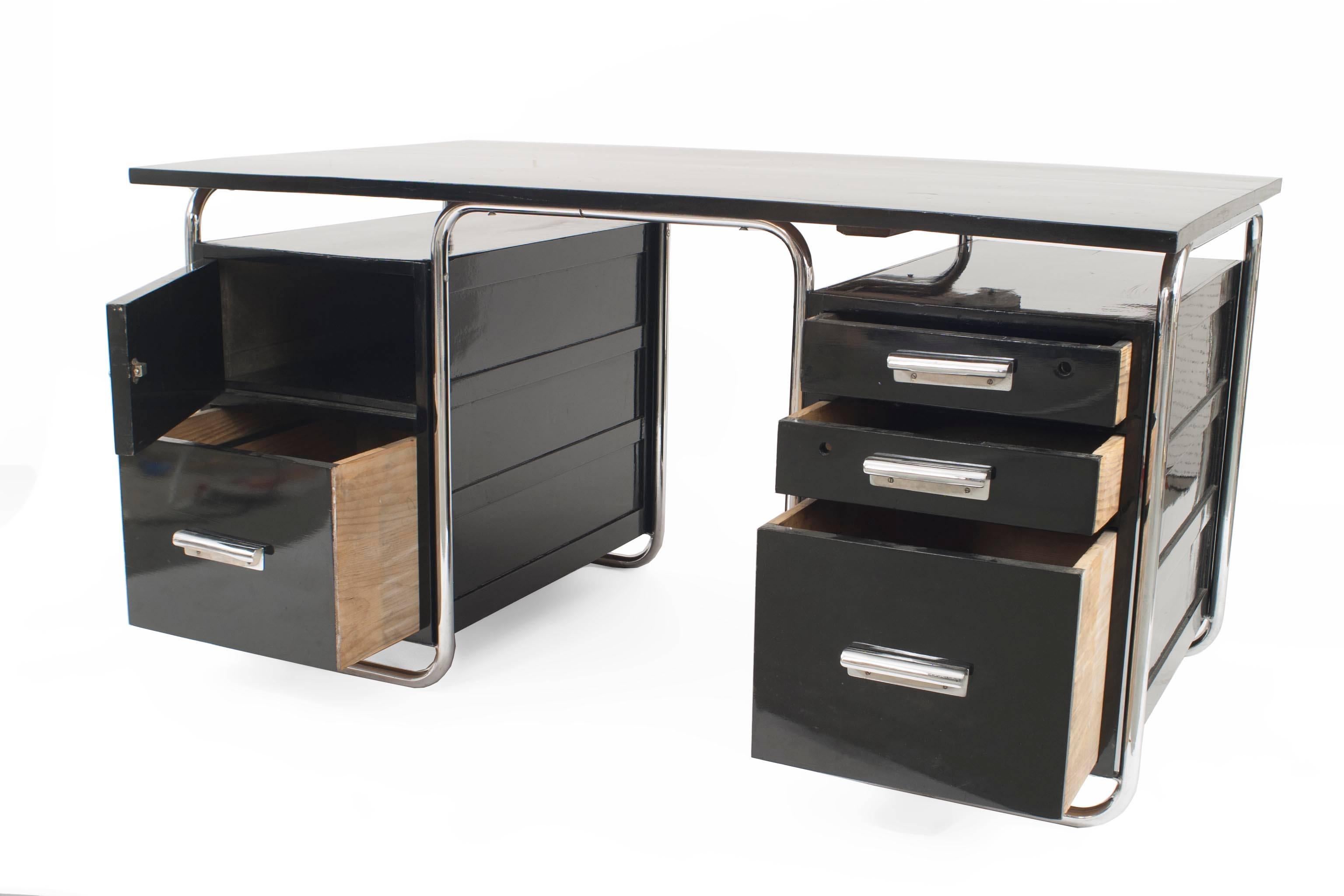 German Art Deco black enameled wood desk with chrome trim having a top floating over 2 sets of drawers (designed by MARCEL BREUER; mfg by THONET) (Related Item: 061133A)
