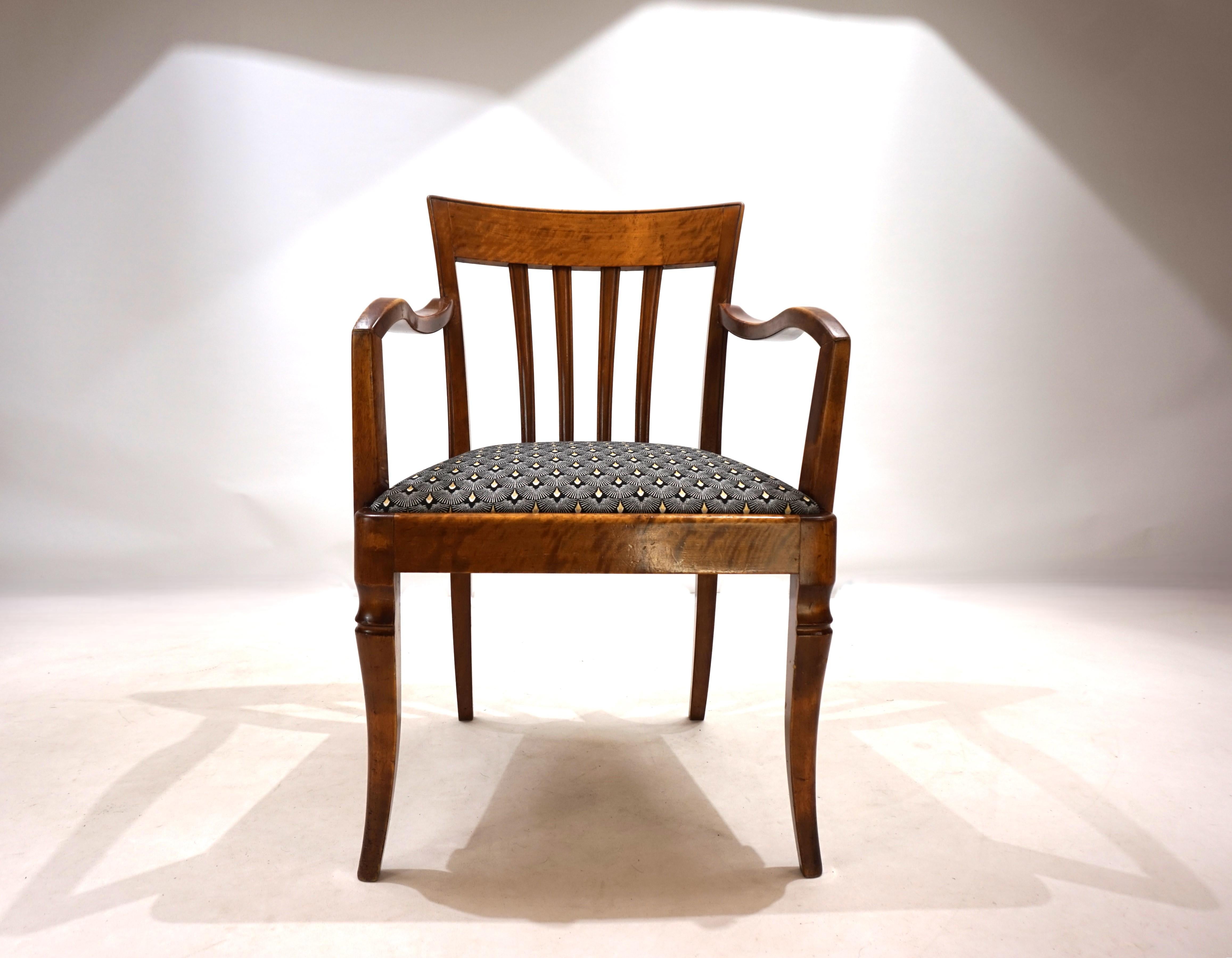 This chair, which is unusual in its dimensions, is in excellent condition. The wooden frame, probably made of beech, shows minimal signs of wear and tear, all joints are solid. The seat cushion has been reupholstered with an attractive Art Deco