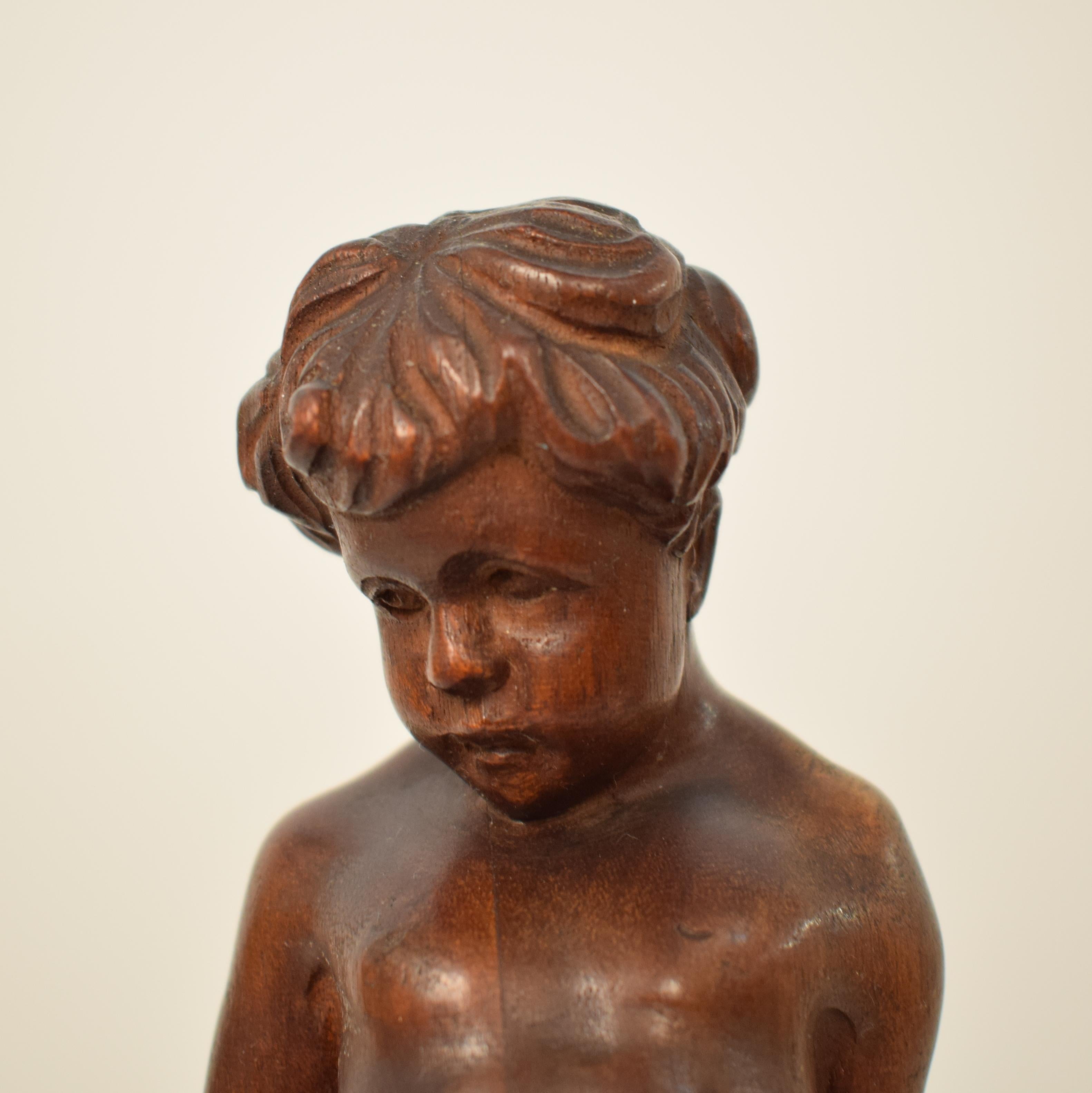 German Art Deco Carved Wooden Walnut Sculpture of a Boy with Ebonized Base 1927 5