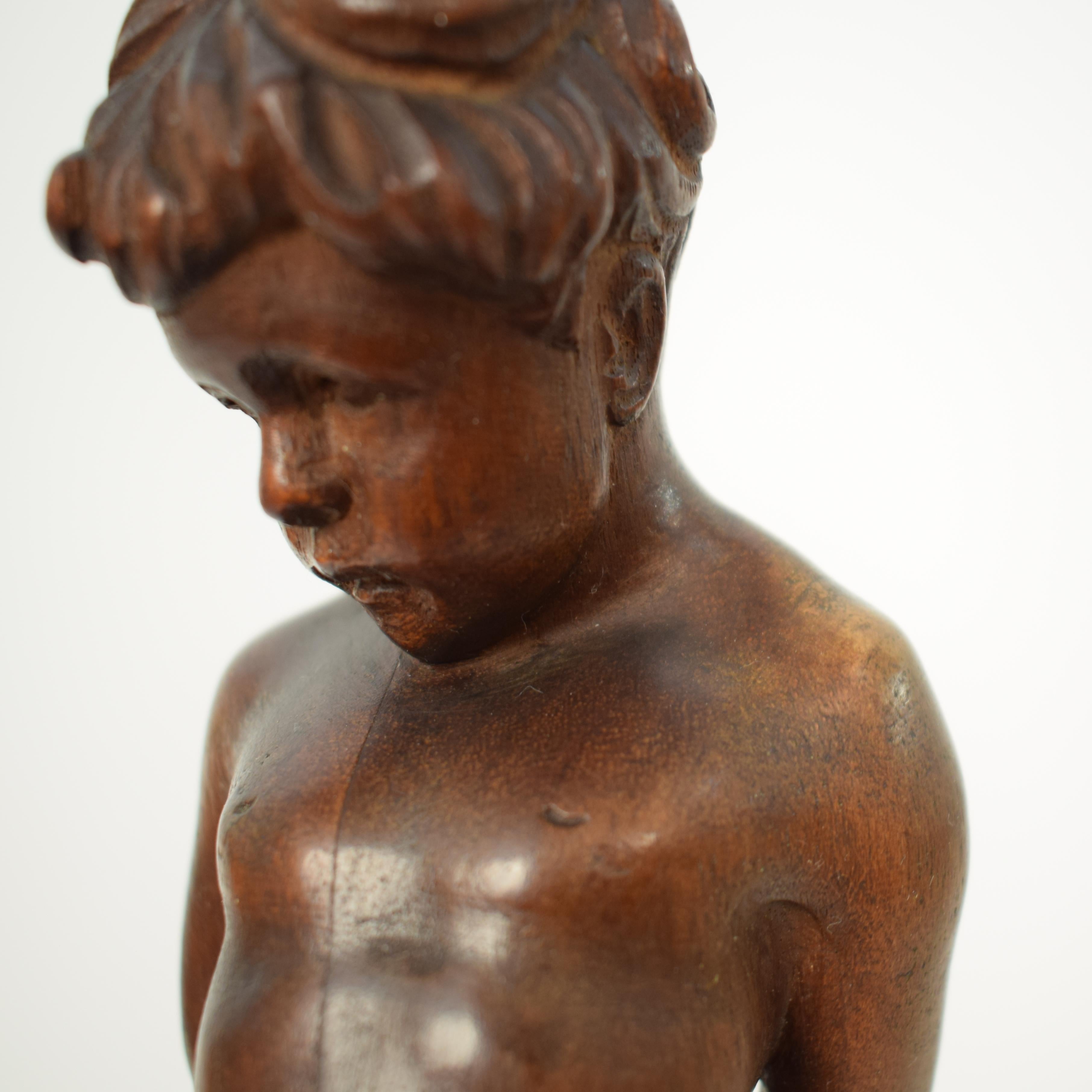 German Art Deco Carved Wooden Walnut Sculpture of a Boy with Ebonized Base 1927 6