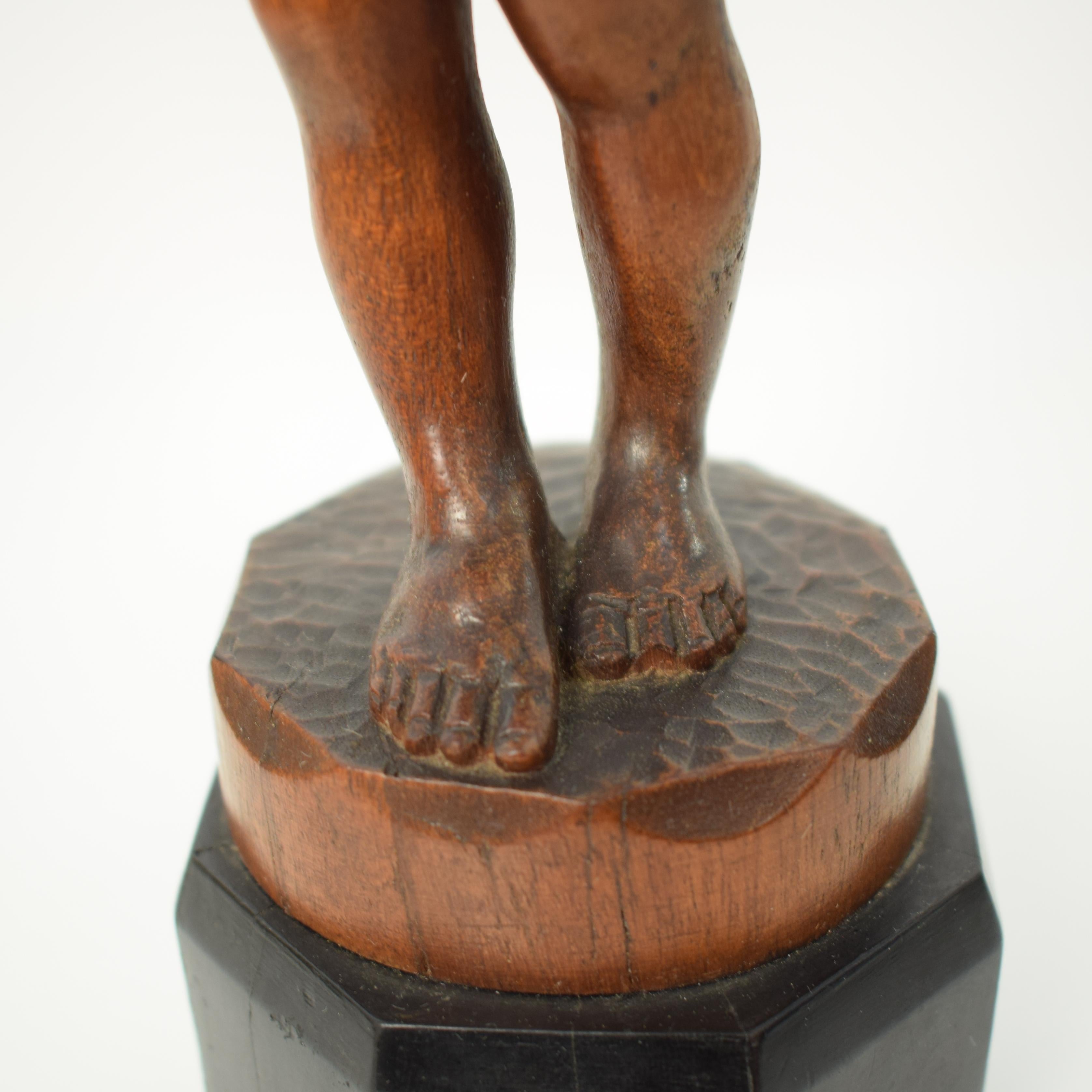 German Art Deco Carved Wooden Walnut Sculpture of a Boy with Ebonized Base 1927 8