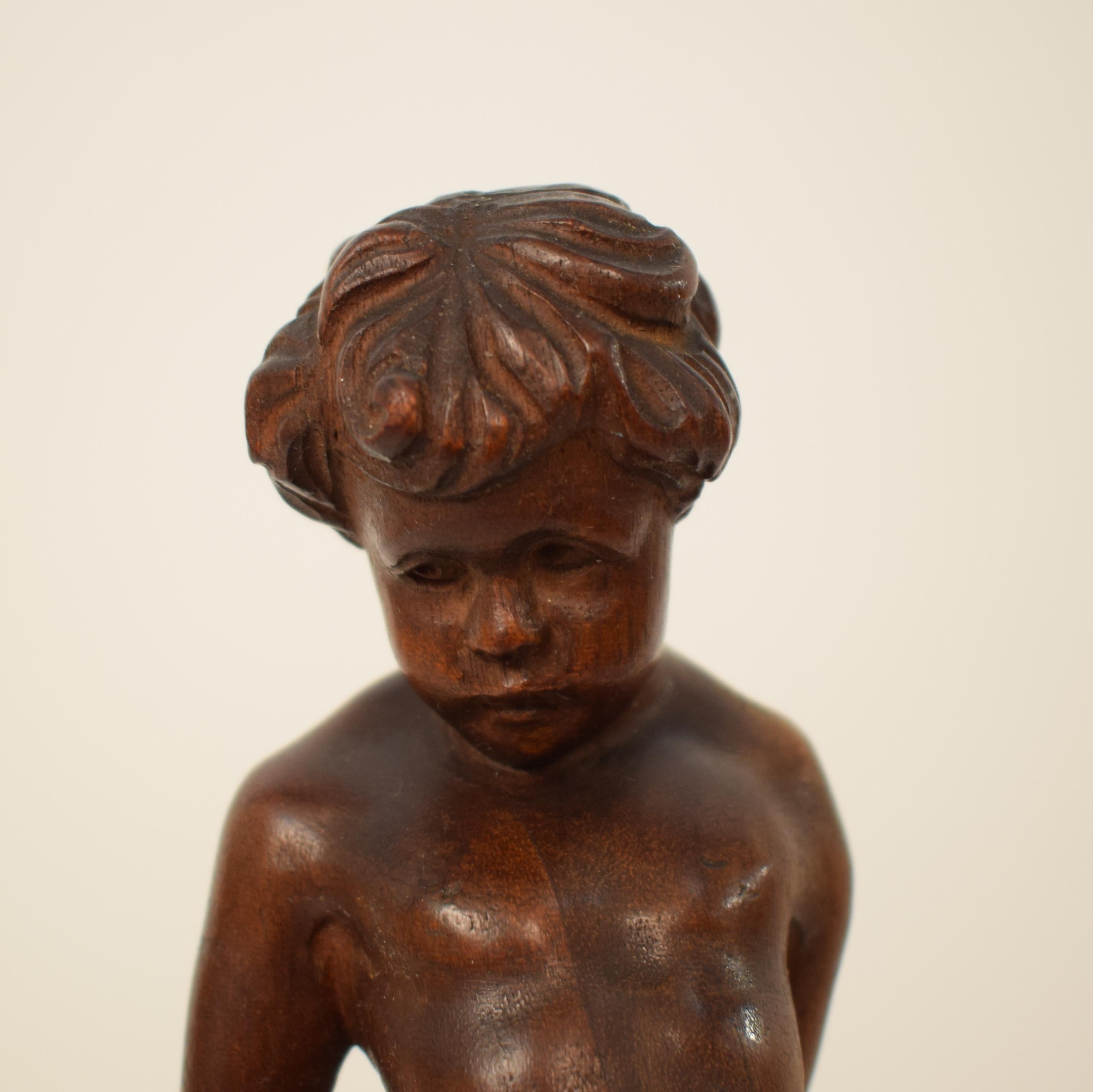 This beautiful German Art Deco carved wooden sculpture of a Boy was done in walnut and has got a pear wood ebonized base. It is signed 1927.
Probably made in Berlin. Wonderful details in the carving.
A unique piece which is a great eyecatcher for