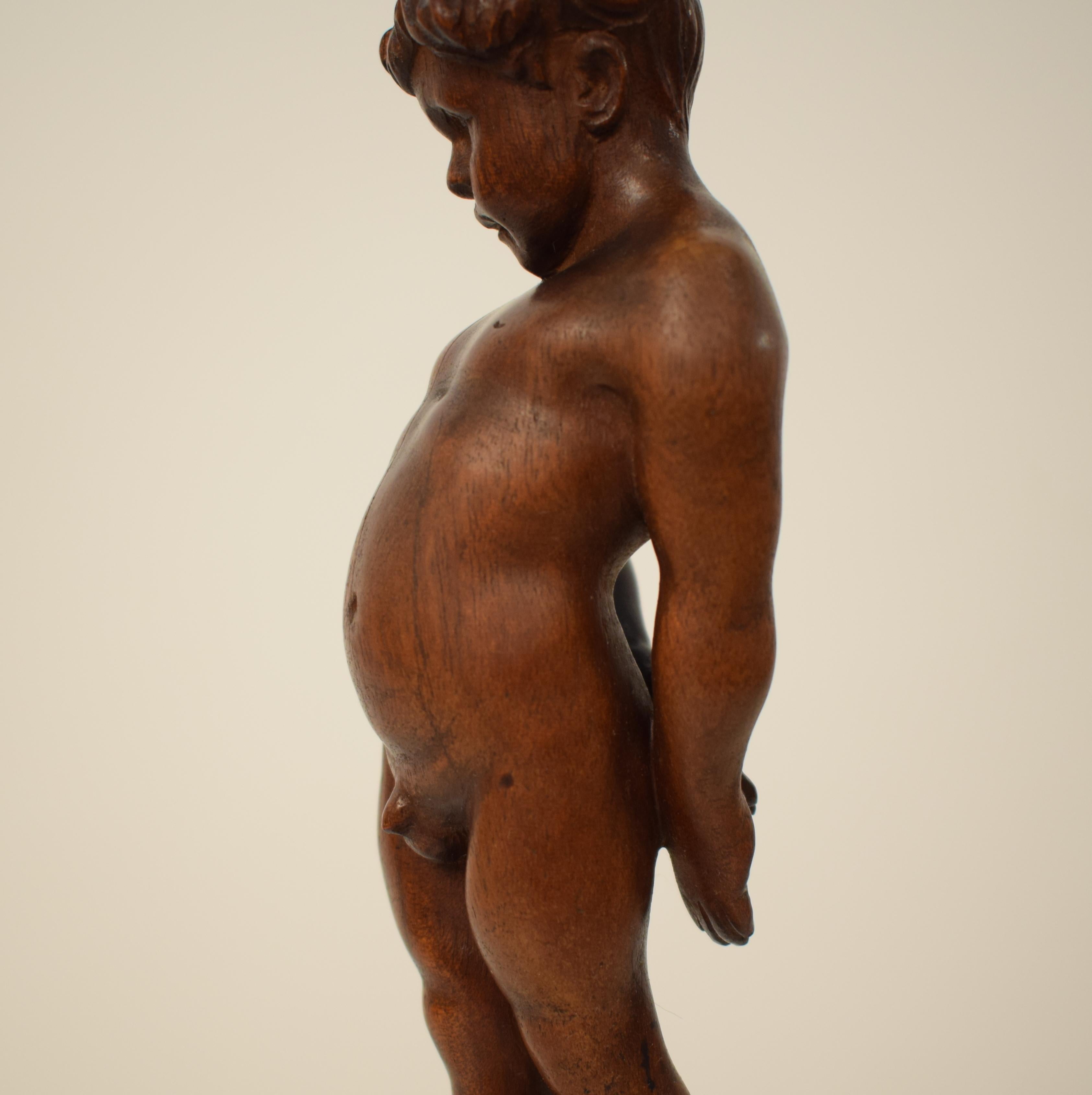 Pearwood German Art Deco Carved Wooden Walnut Sculpture of a Boy with Ebonized Base 1927