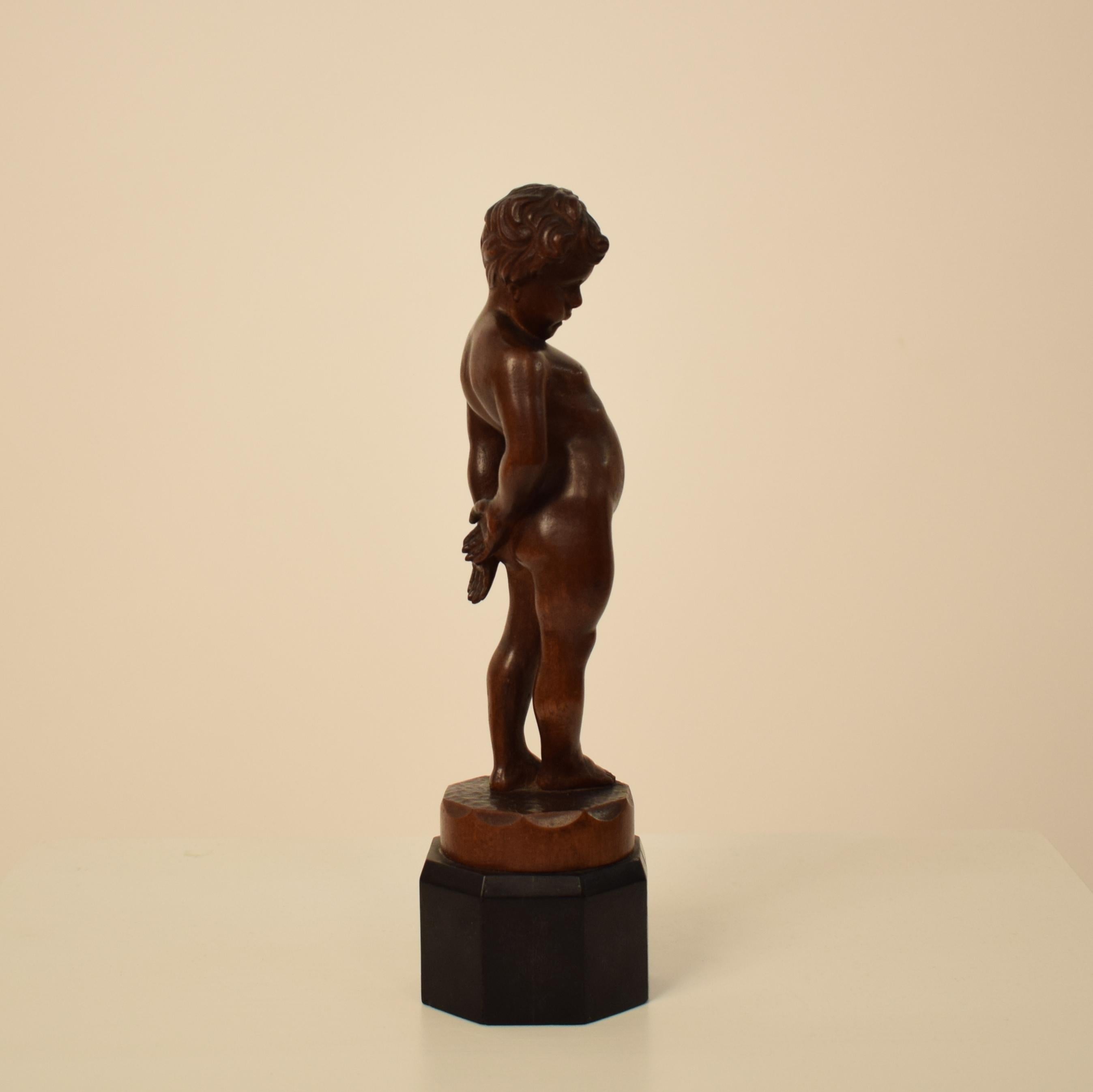 German Art Deco Carved Wooden Walnut Sculpture of a Boy with Ebonized Base 1927 2