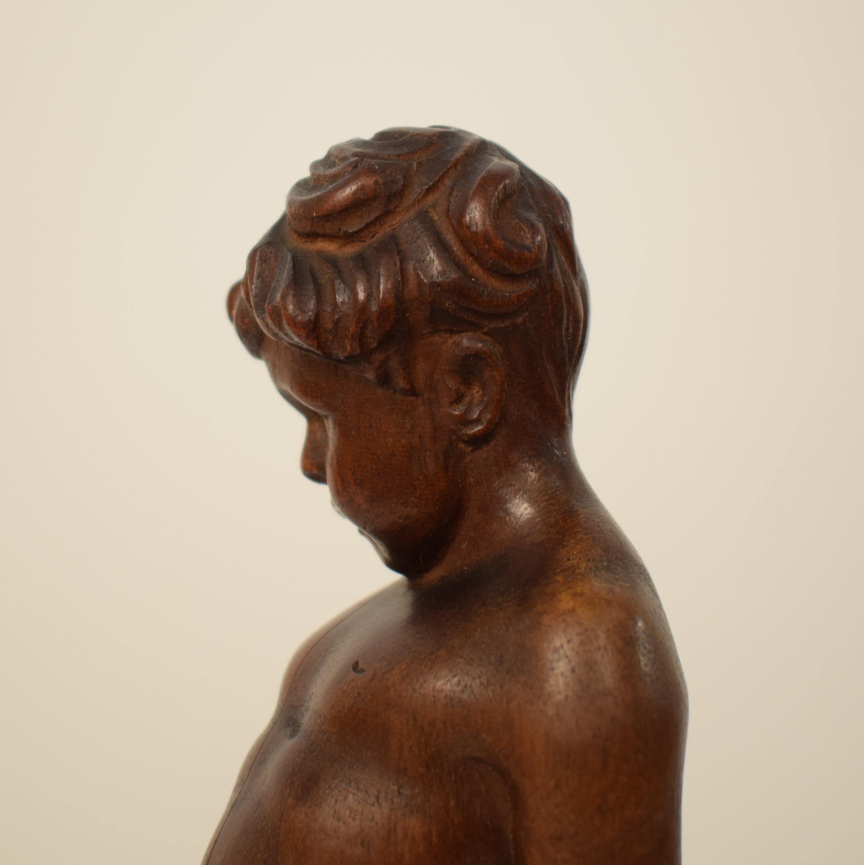 German Art Deco Carved Wooden Walnut Sculpture of a Boy with Ebonized Base 1927 3