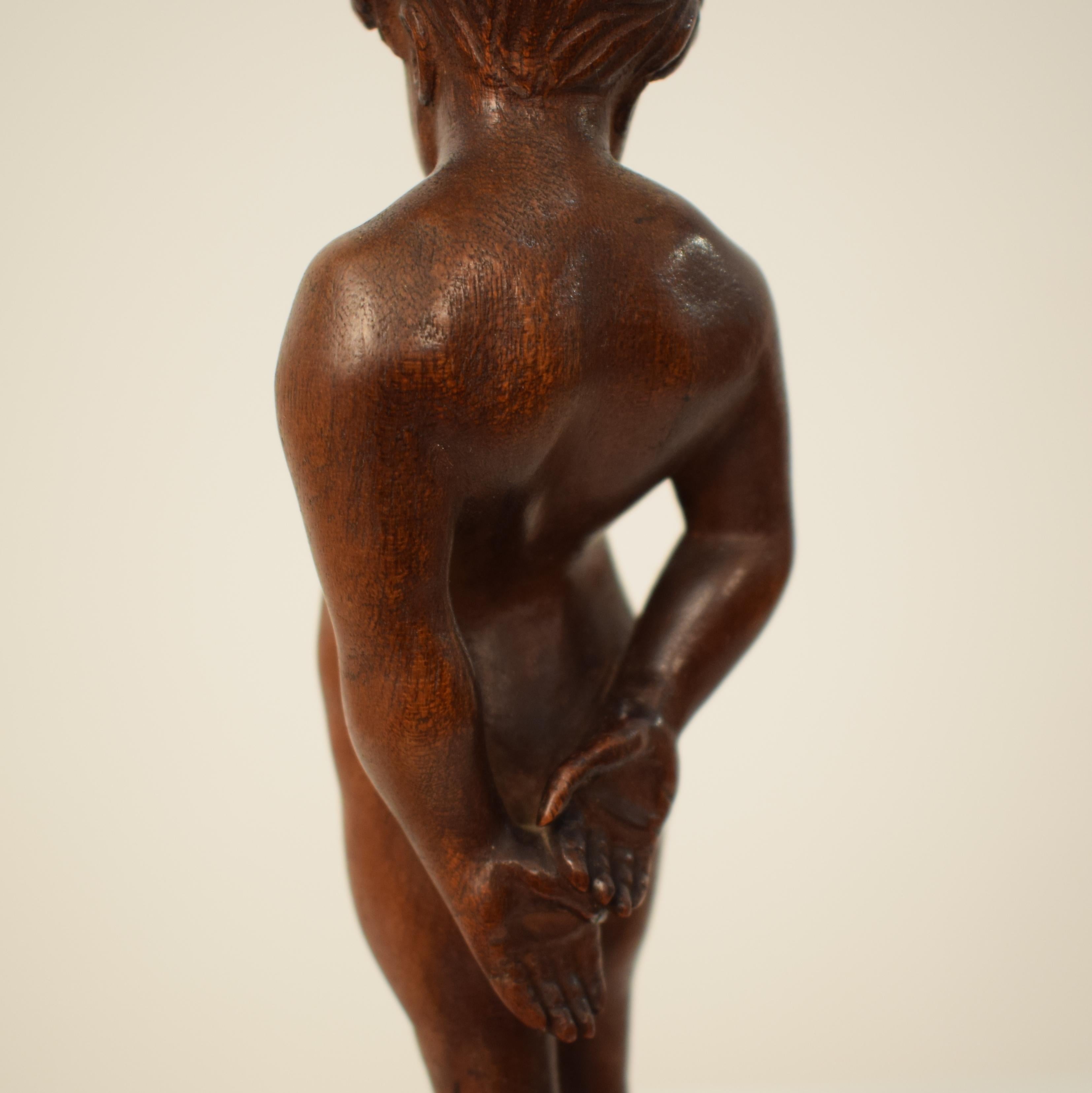 German Art Deco Carved Wooden Walnut Sculpture of a Boy with Ebonized Base 1927 4
