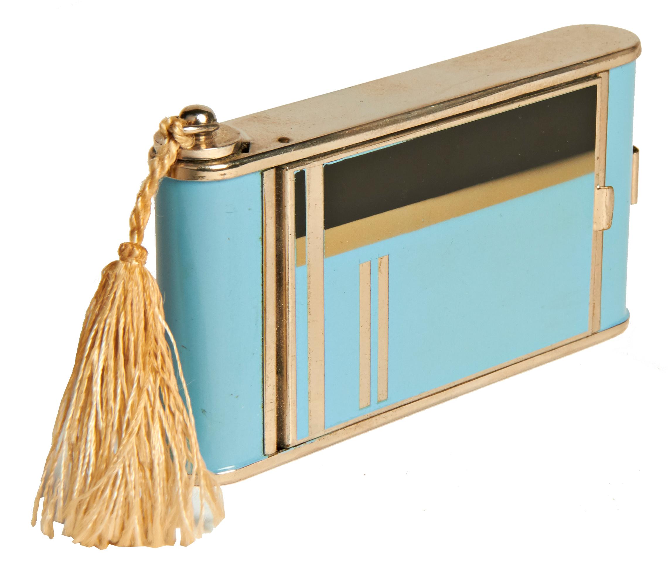 This beautifully designed German Art Deco camera compact/minaudiere features robin egg blue enamel with a geometric design in black enamel and chrome. On one side it has a large lift-top compact with mirror in mint and unused condition and complete
